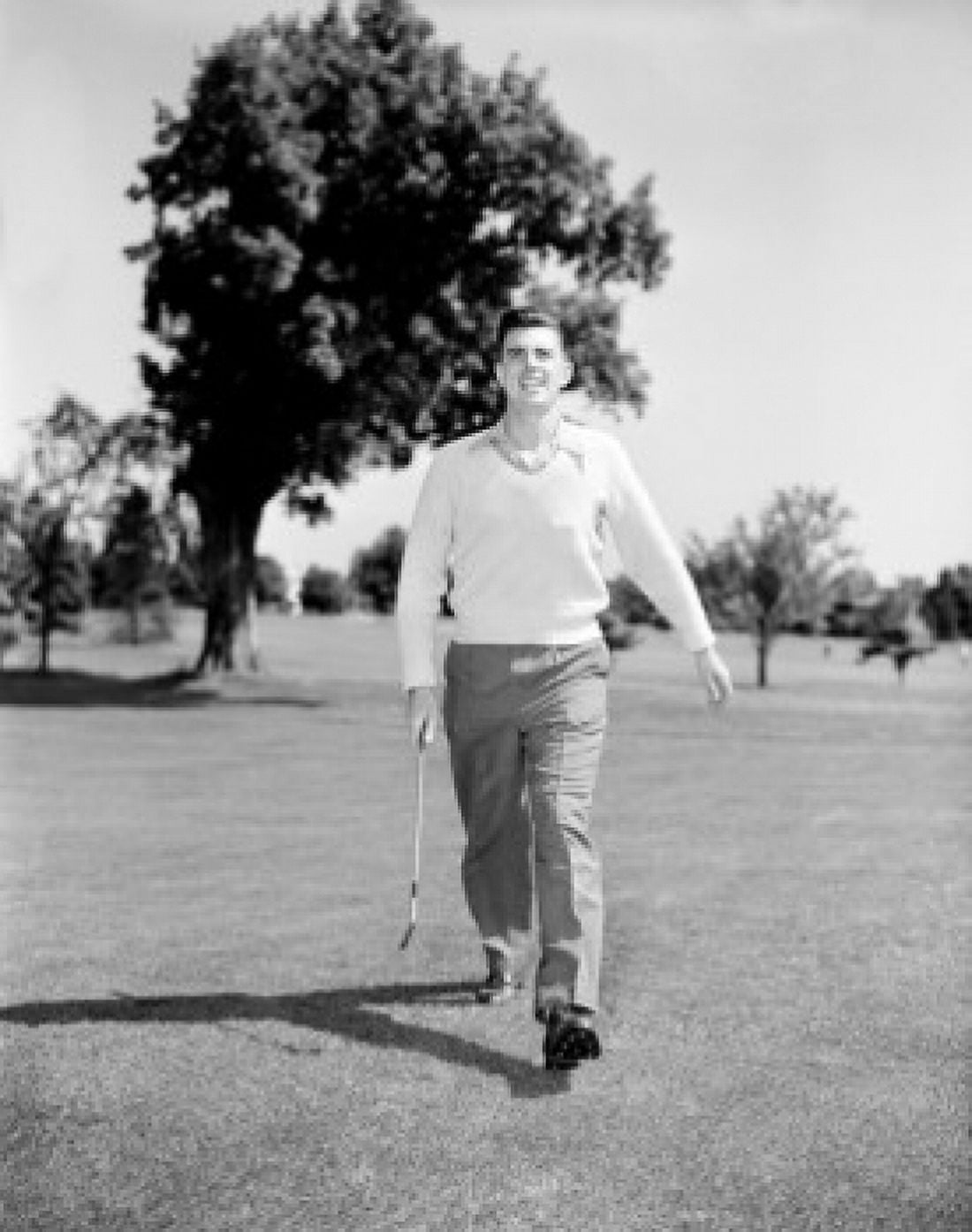 Young man playing golf Canvas Art - (24 x 36)