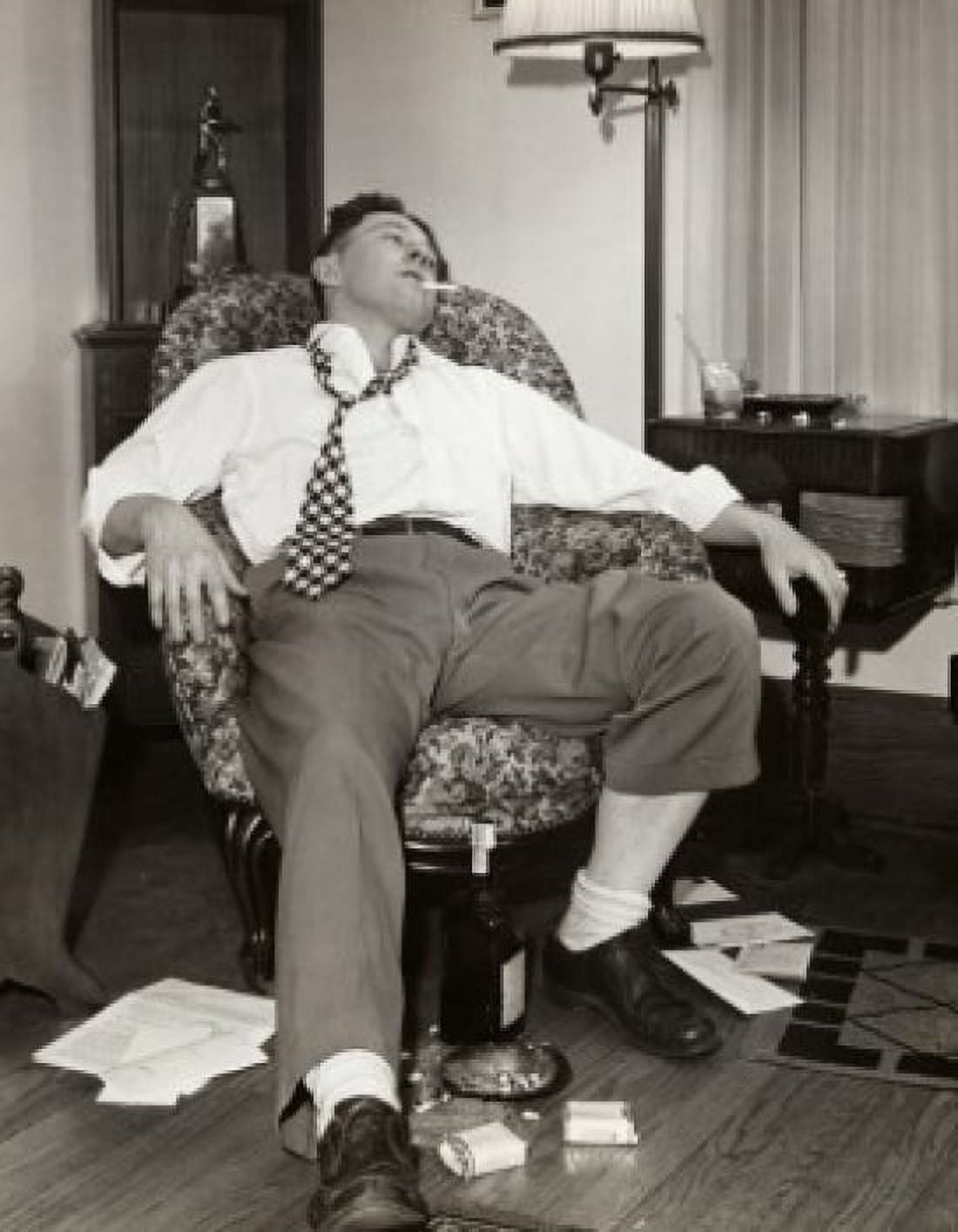 Young man resting on an armchair drunk Canvas Art - (18 x 24)