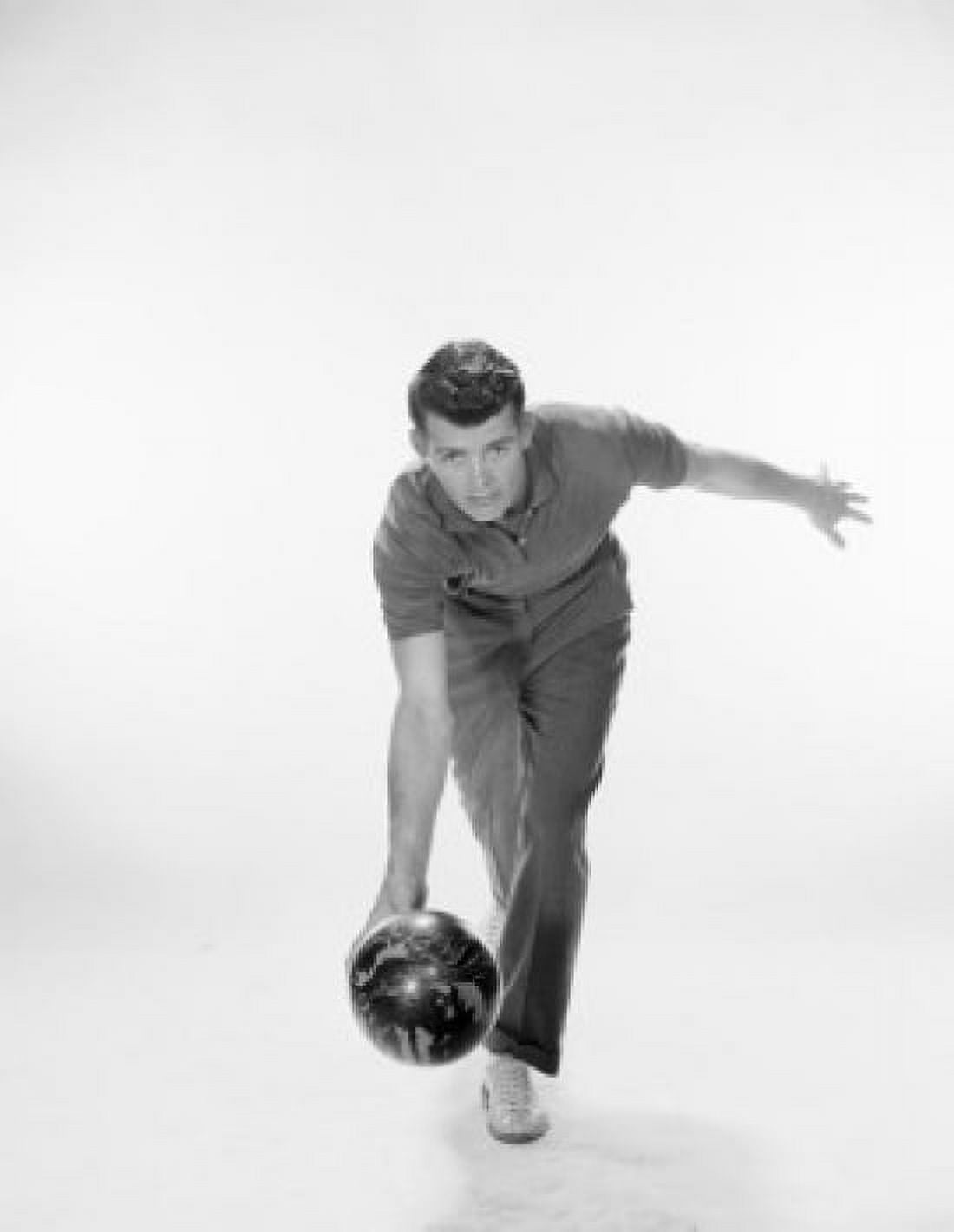 Young man rolling a bowling ball Canvas Art - (18 x 24)