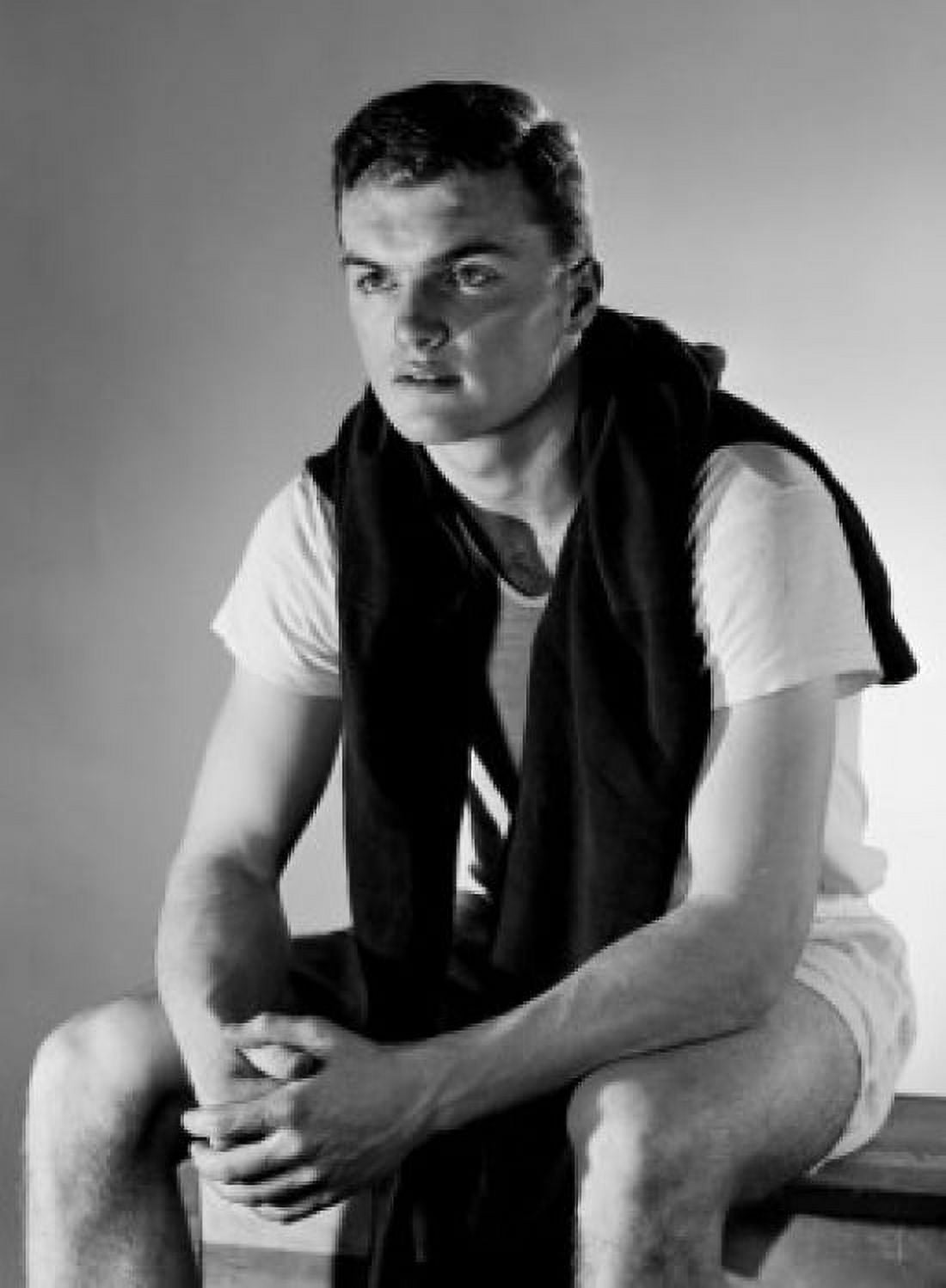 Young man sitting and looking away Canvas Art - (24 x 36)