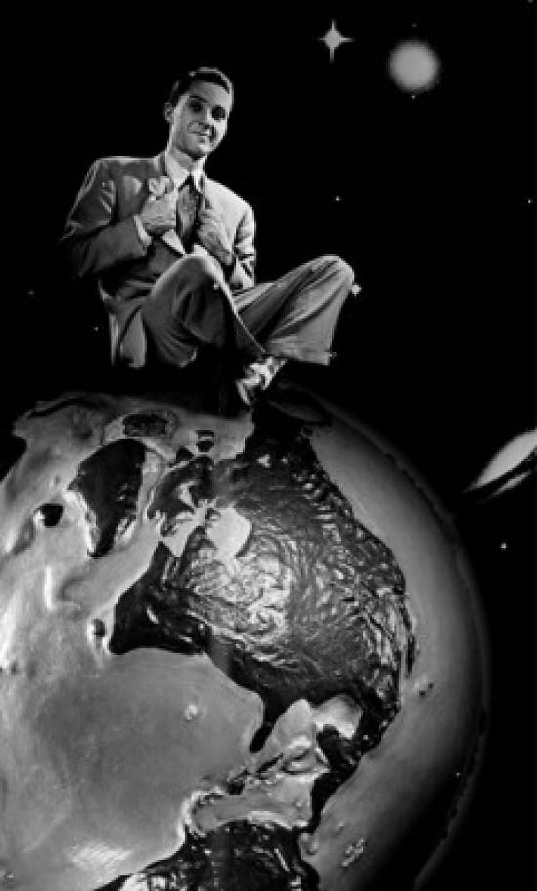 Young man sitting on top of globe Canvas Art - (18 x 24)