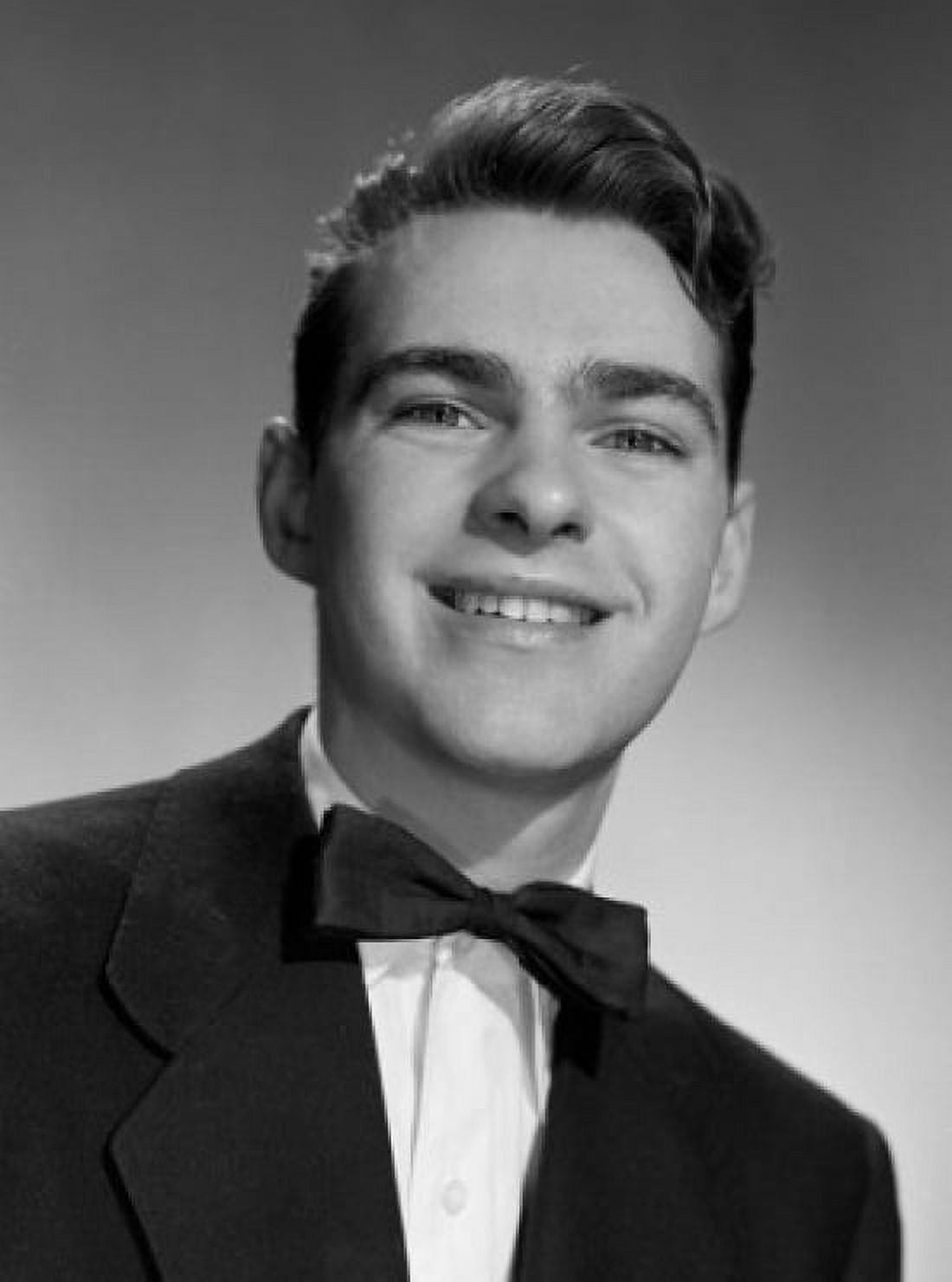 Young man smiling and wearing bow tie portrait Canvas Art - (18 x 24)