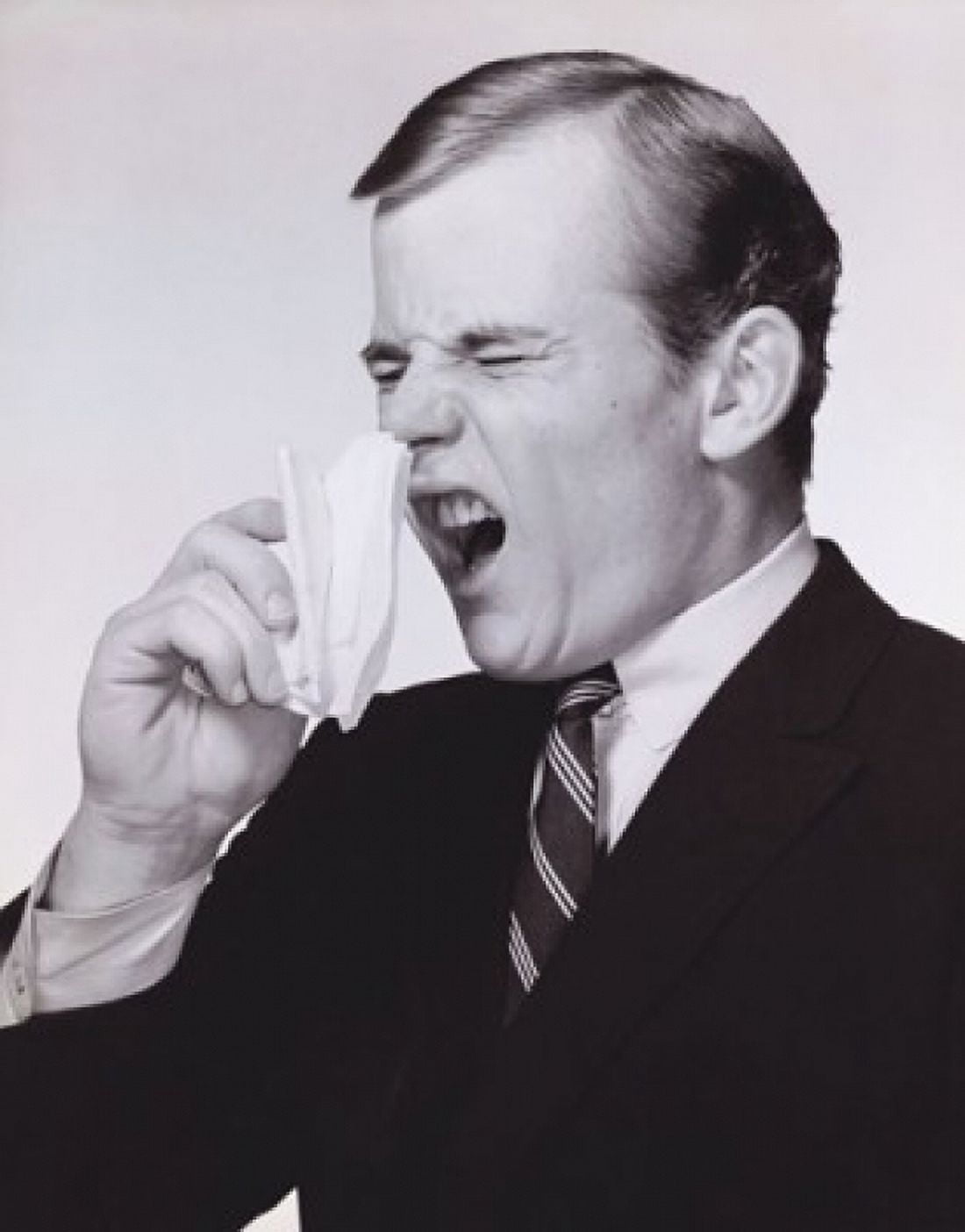 Young man sneezing Canvas Art - (18 x 24)
