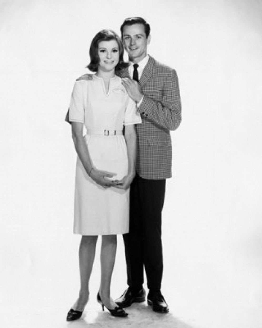 Young man standing with his arm around a young woman Canvas Art - (18 x 24)