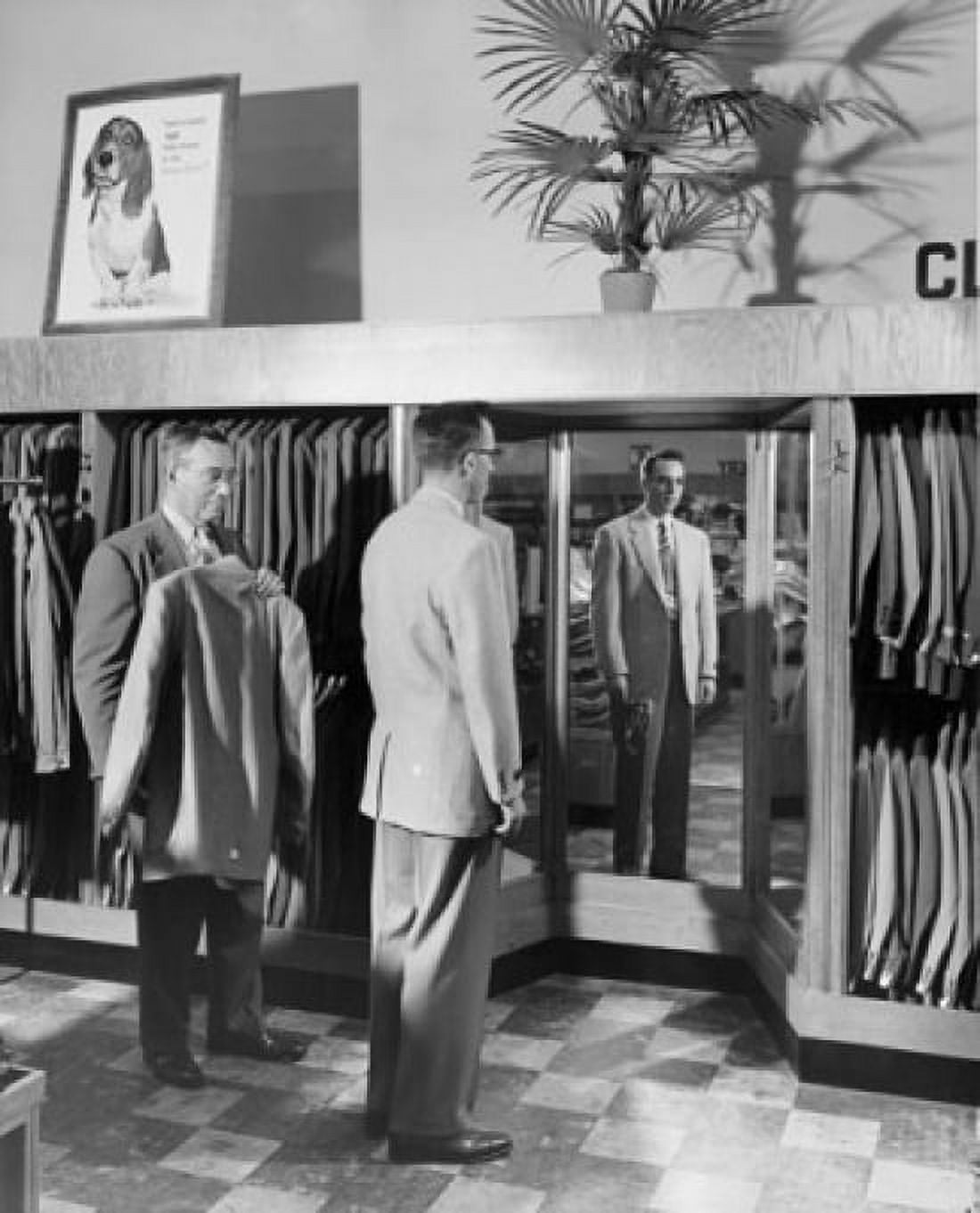 Young man trying suit in clothing store Canvas Art - (18 x 24)