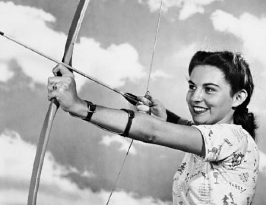 Young woman aiming a bow and arrow Canvas Art - (18 x 24)
