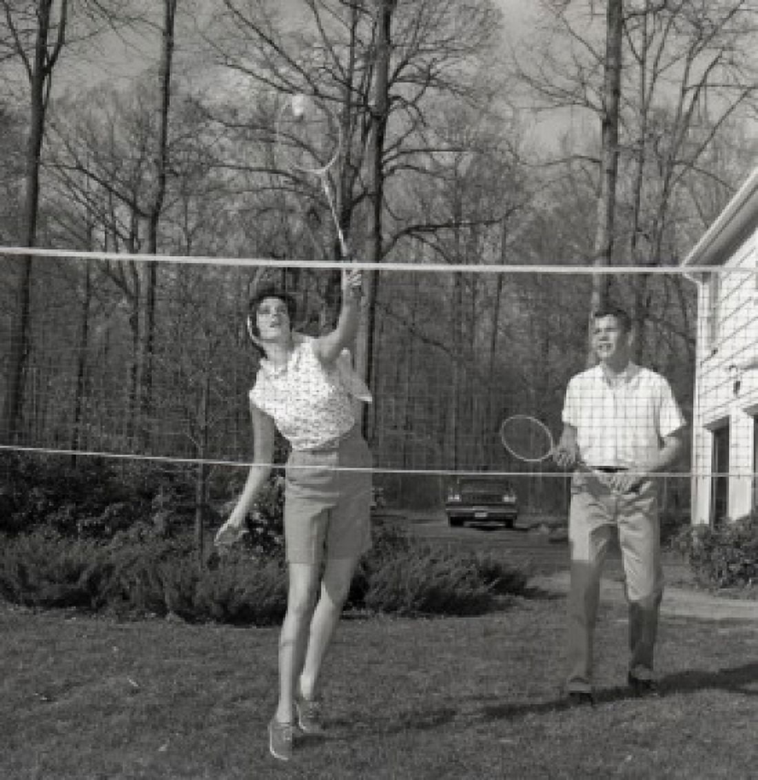 Young woman and young man playing badminton Canvas Art - (18 x 24)