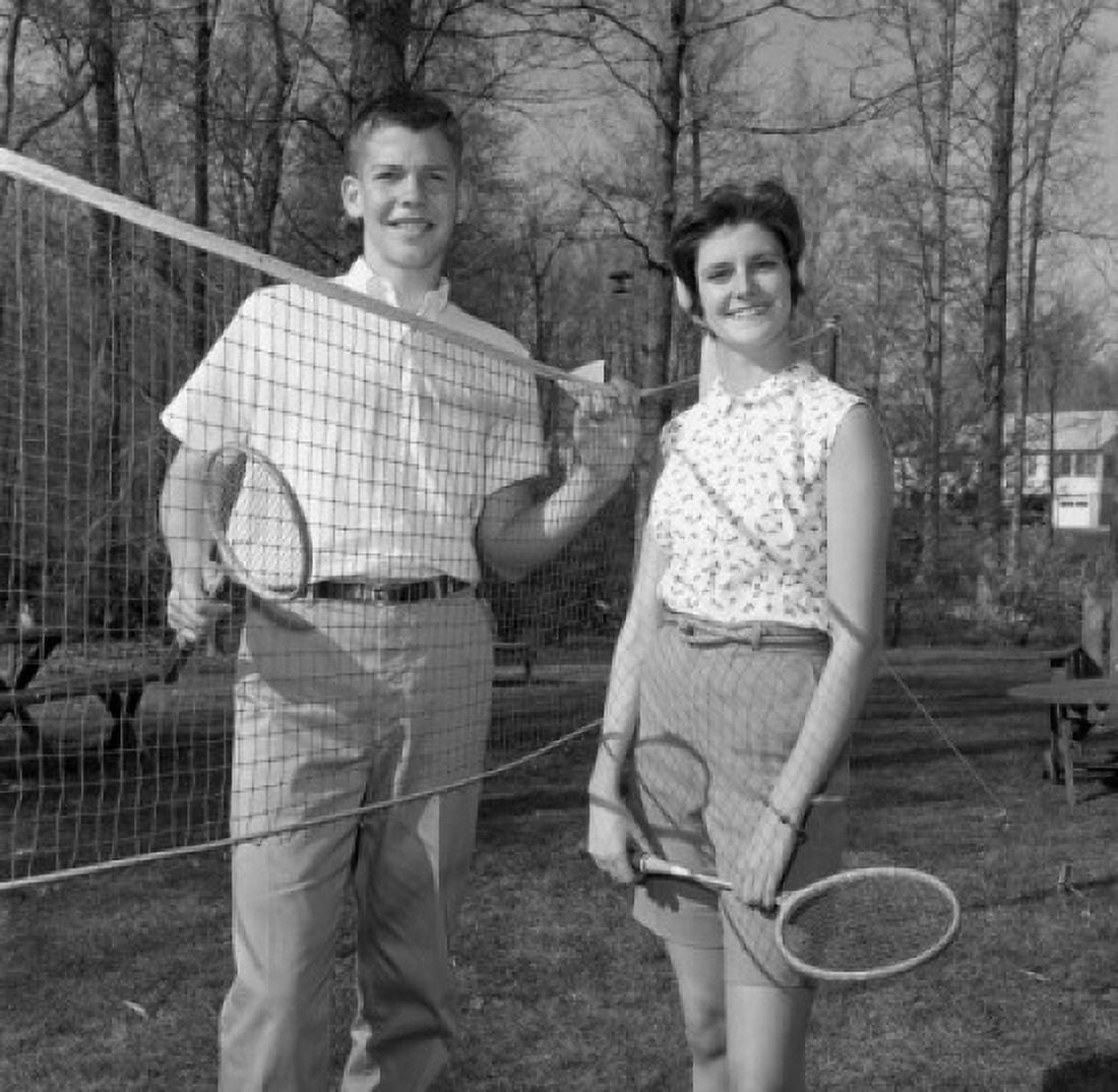 Young woman and young man playing badminton Canvas Art - (24 x 36)