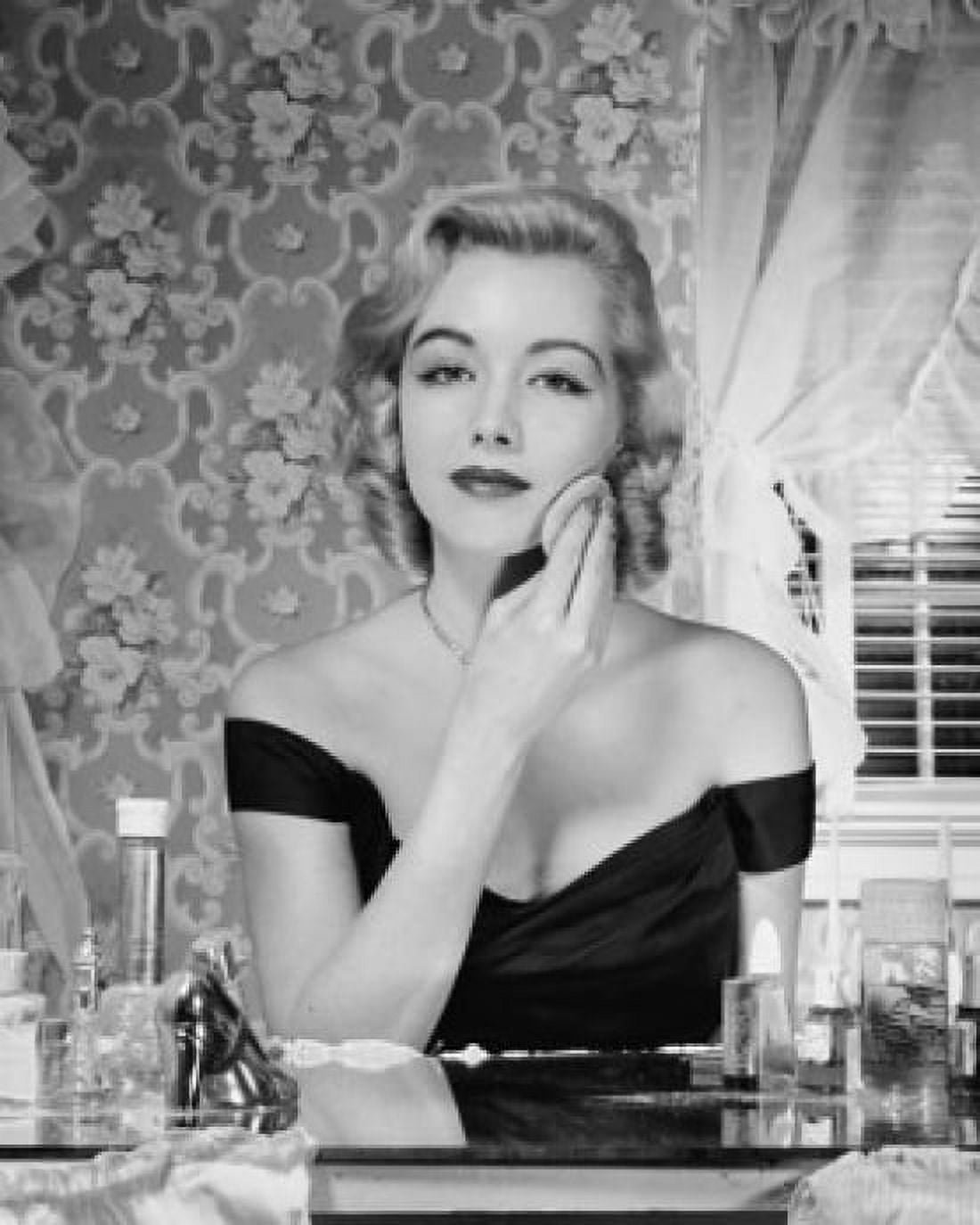 Young woman applying make-up to face Canvas Art - (18 x 24)