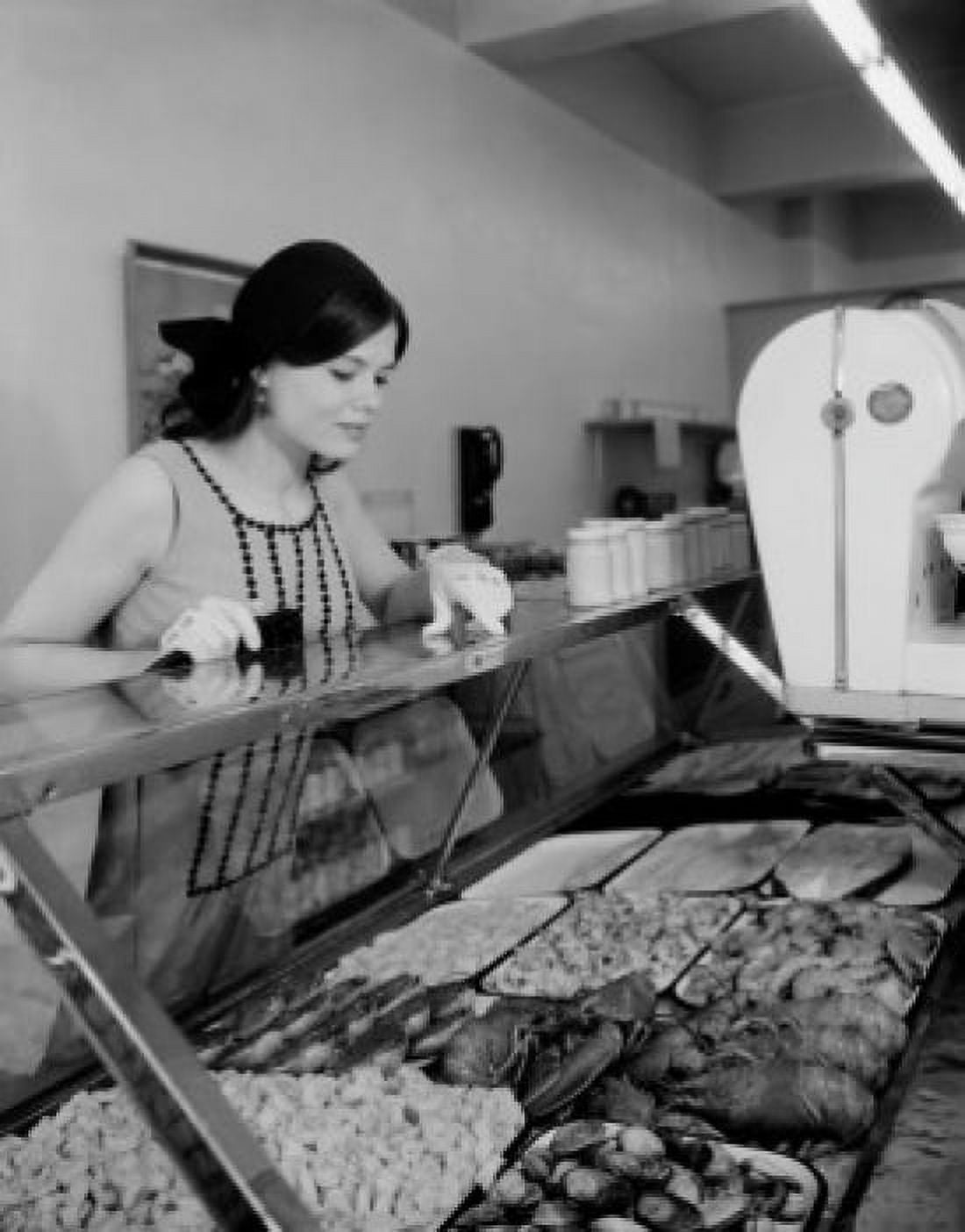 Young woman at meat shop counter Canvas Art - (24 x 36)