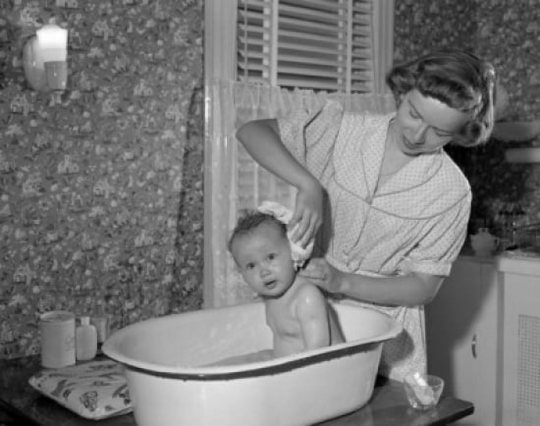 Young woman bathing baby Canvas Art - (18 x 24)