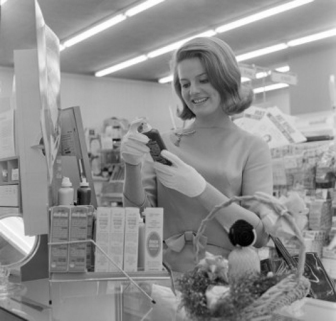 Young woman browsing through cosmetics in super market Canvas Art - (18 x 24)