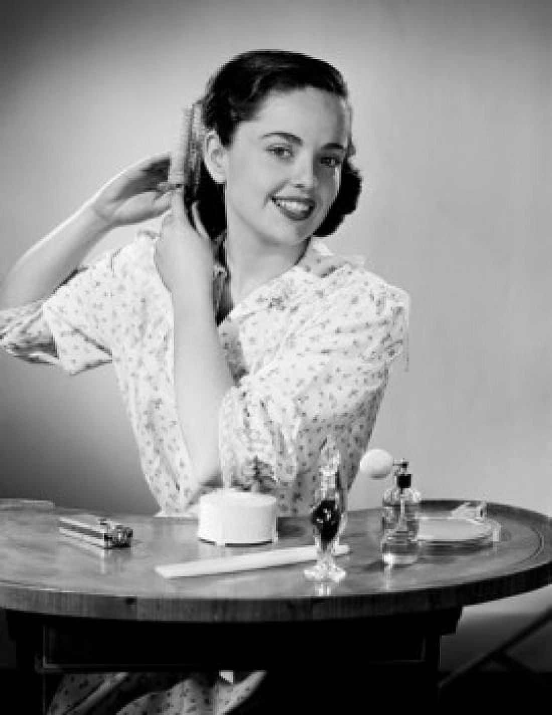 Young woman brushing hair Canvas Art - (18 x 24)