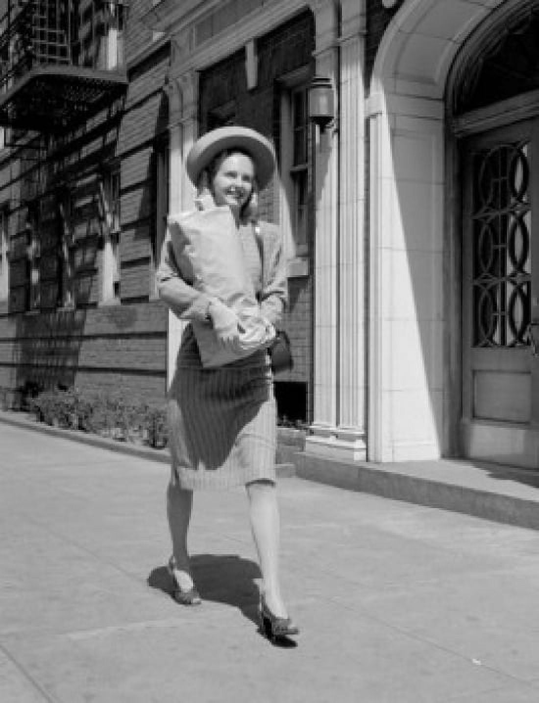 Young woman carrying groceries in city Canvas Art - (24 x 36)