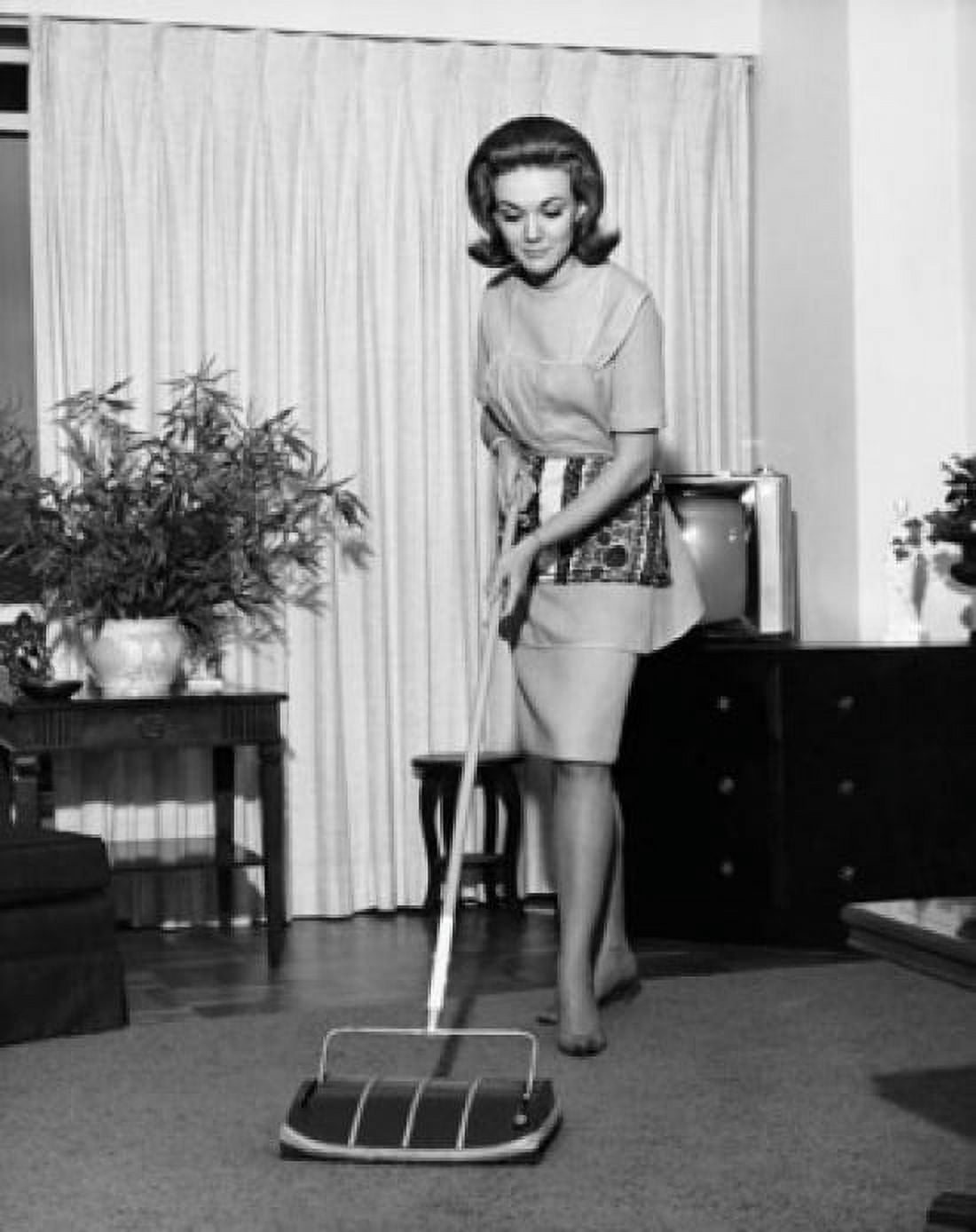 Young woman cleaning carpet Canvas Art - (18 x 24)