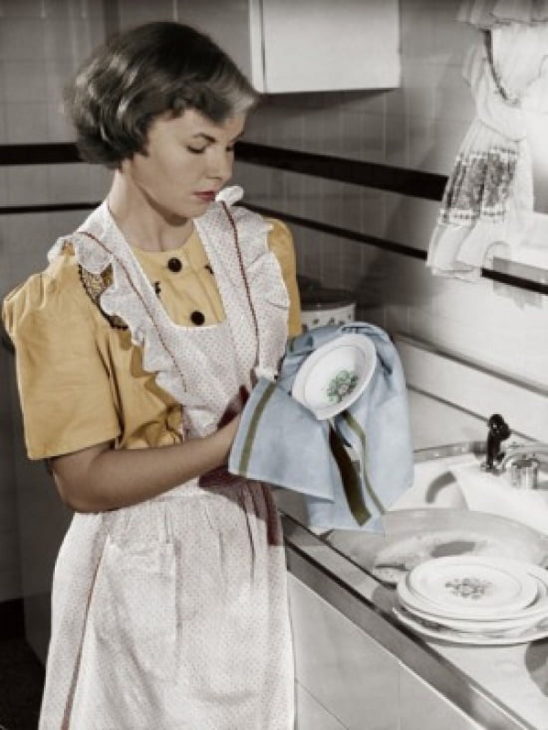 Young woman cleaning dishes in kitchen Canvas Art - (18 x 24)