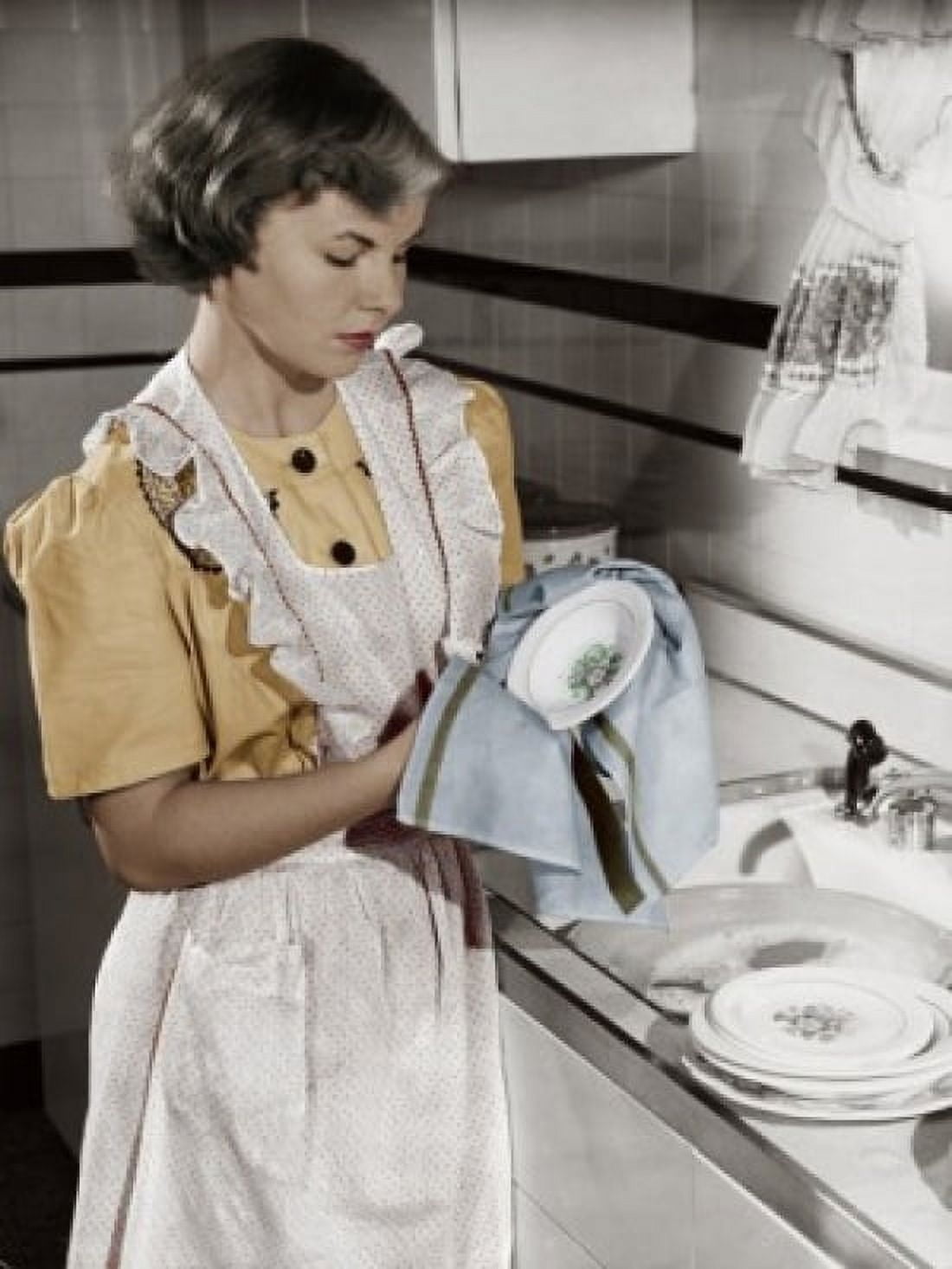 Young woman cleaning dishes in kitchen Canvas Art - (24 x 36)