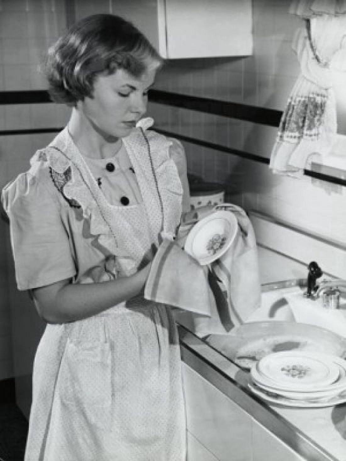 Young woman cleaning dishes with a dish cloth in the kitchen Canvas Art - (24 x 36)