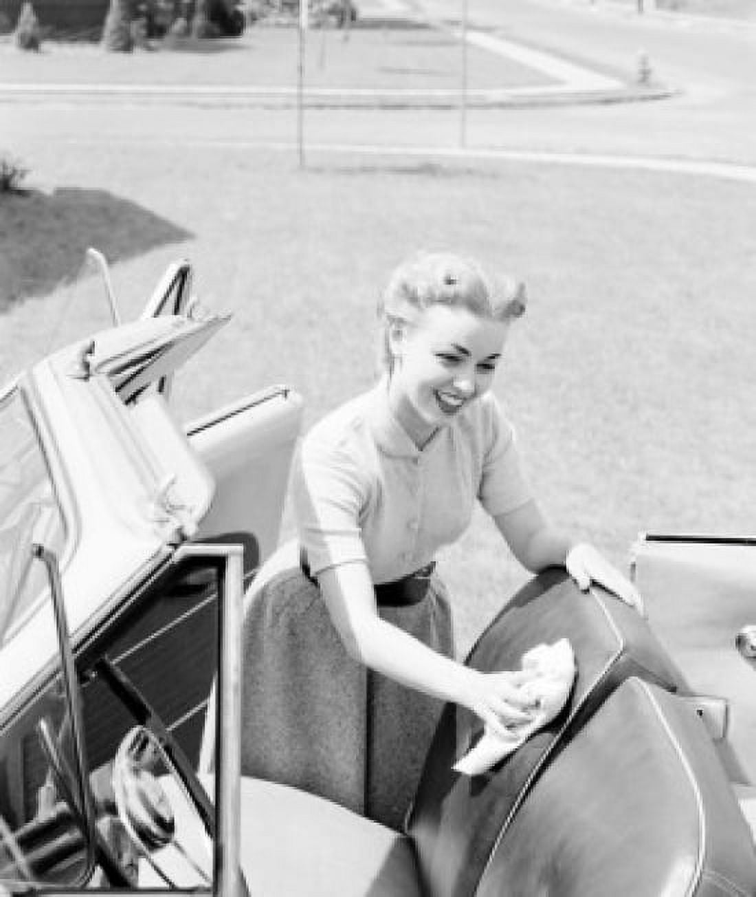 Young woman cleaning seats in car Canvas Art - (24 x 36)