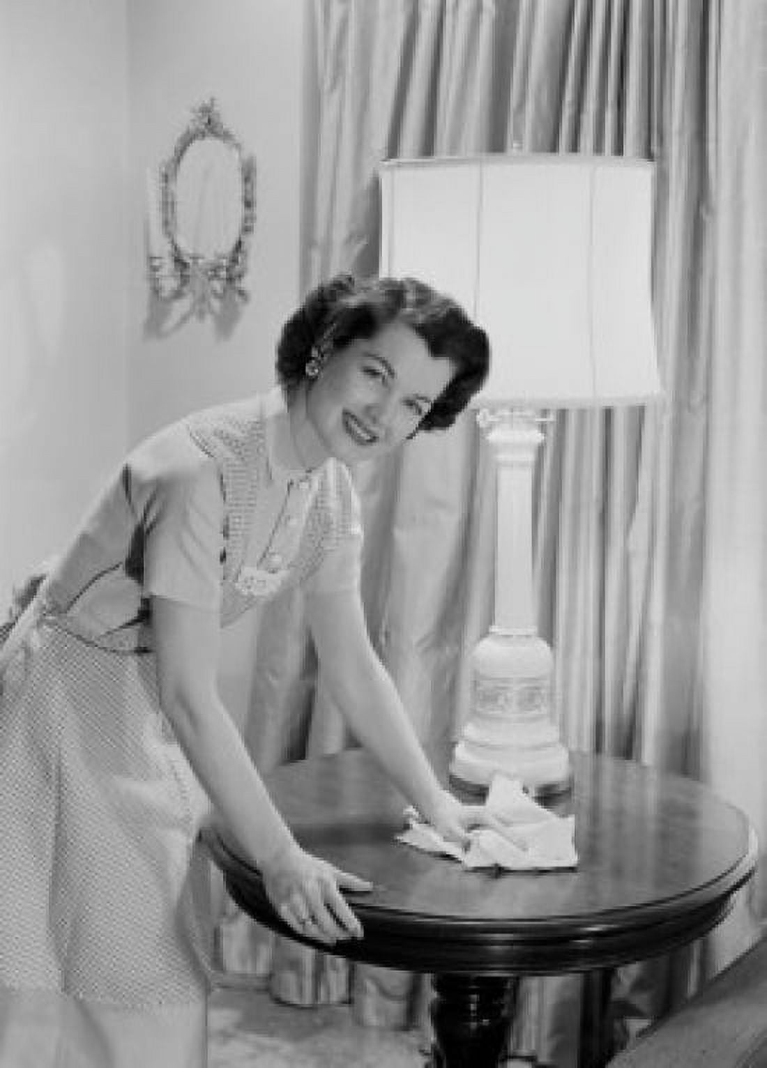Young woman cleaning side table Canvas Art - (18 x 24)