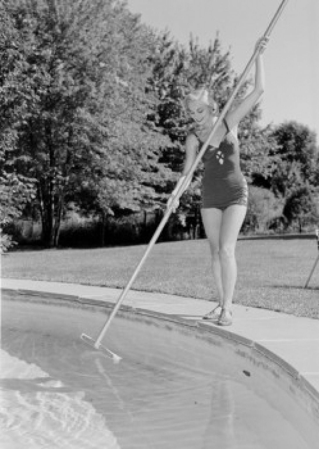 Young woman cleaning swimming pool Canvas Art - (24 x 36)
