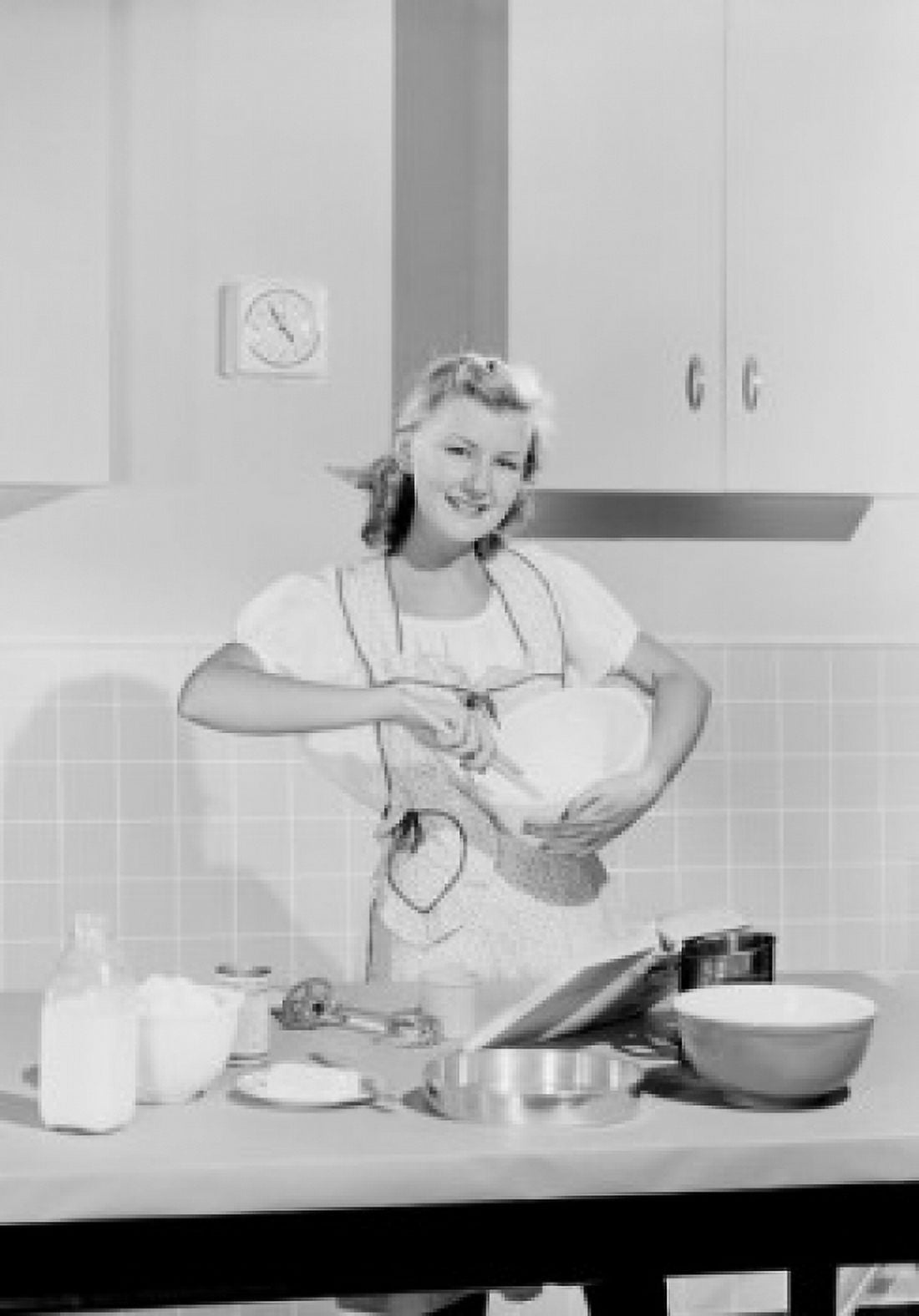 Young woman cooking in kitchen Canvas Art - (18 x 24)