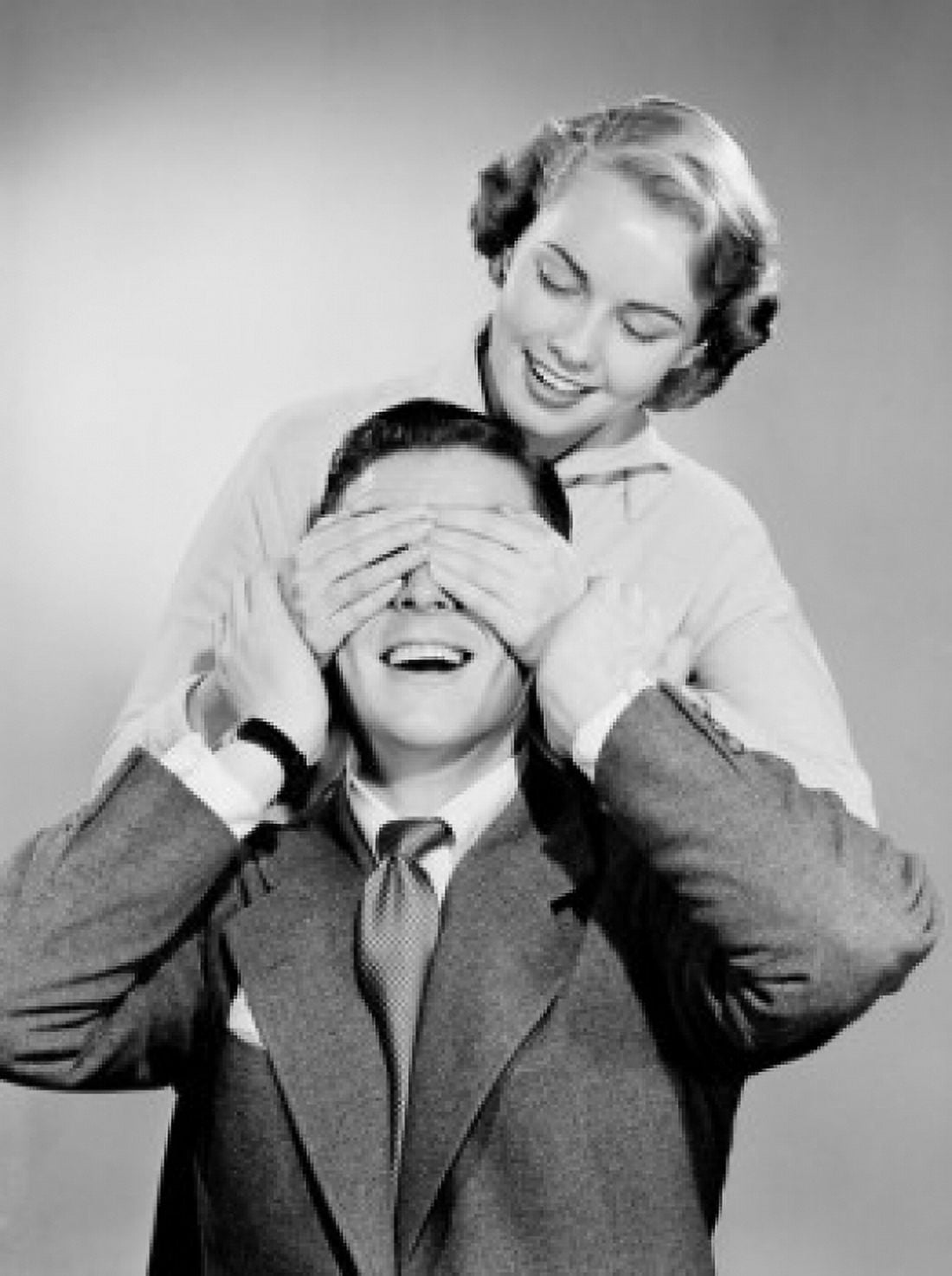 Young woman covering mans eyes Canvas Art - (24 x 36)