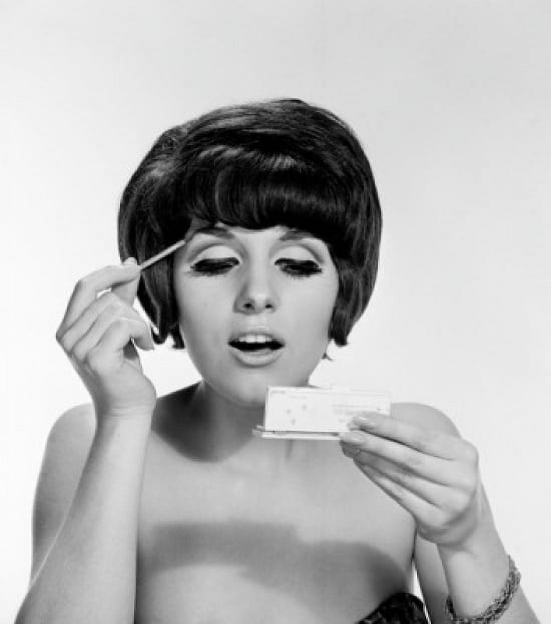 Young woman doing make-up studio shot Canvas Art - (18 x 24)