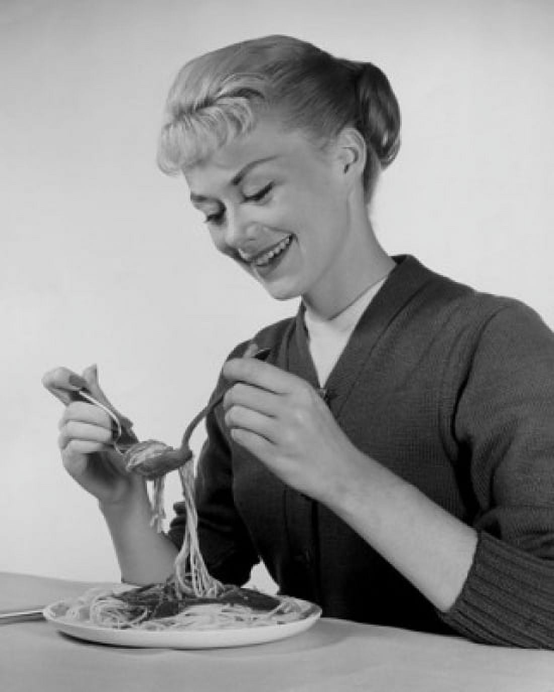 Young woman eating spaghetti Canvas Art - (18 x 24)