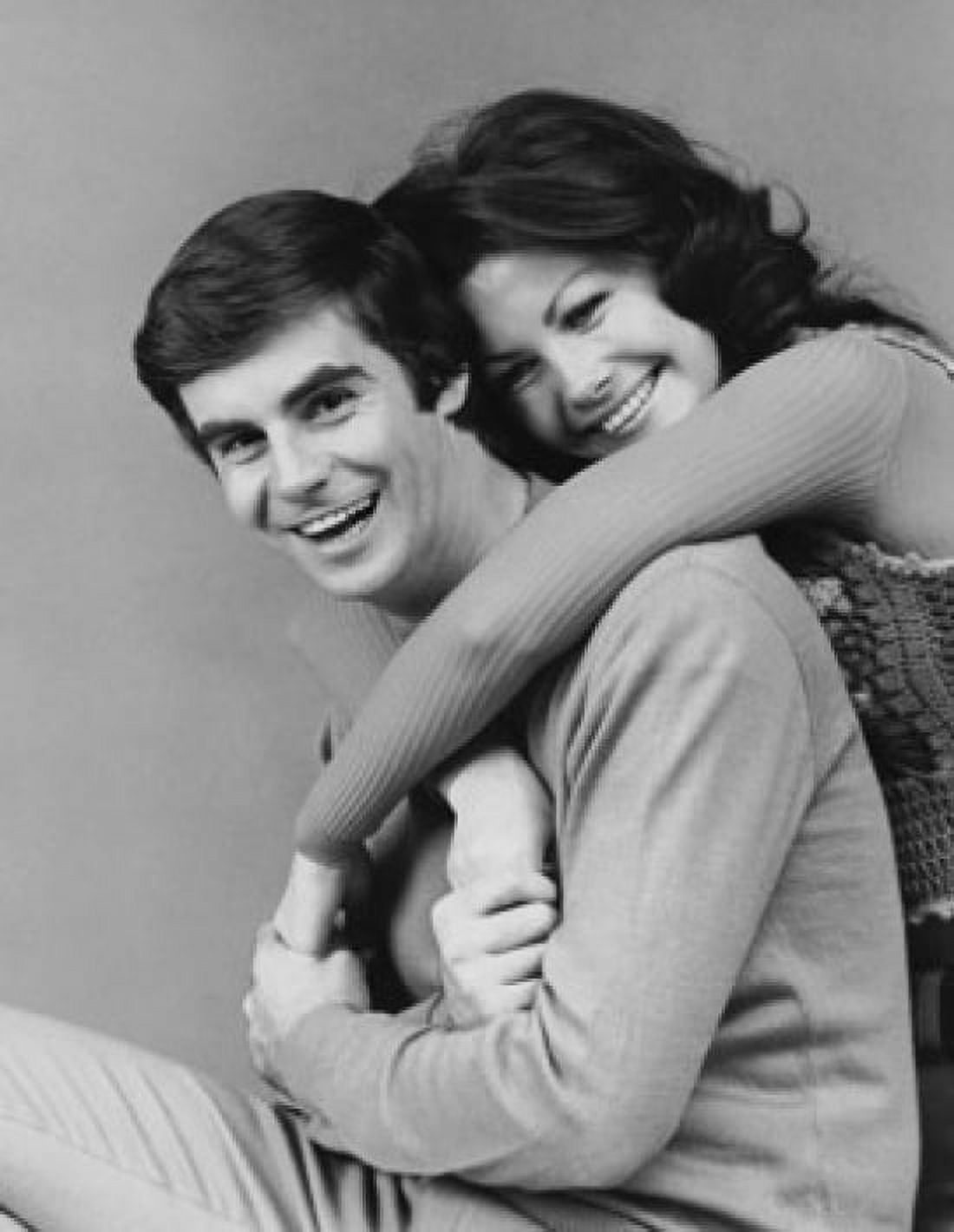 Young woman embracing a young man from behind Canvas Art - (18 x 24)