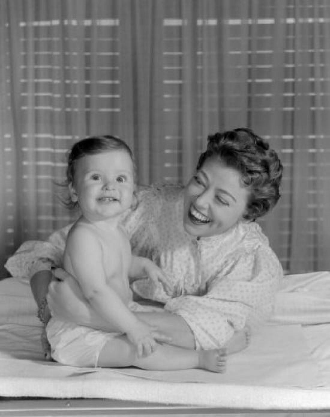 Young woman embracing baby girl Canvas Art - (24 x 36)