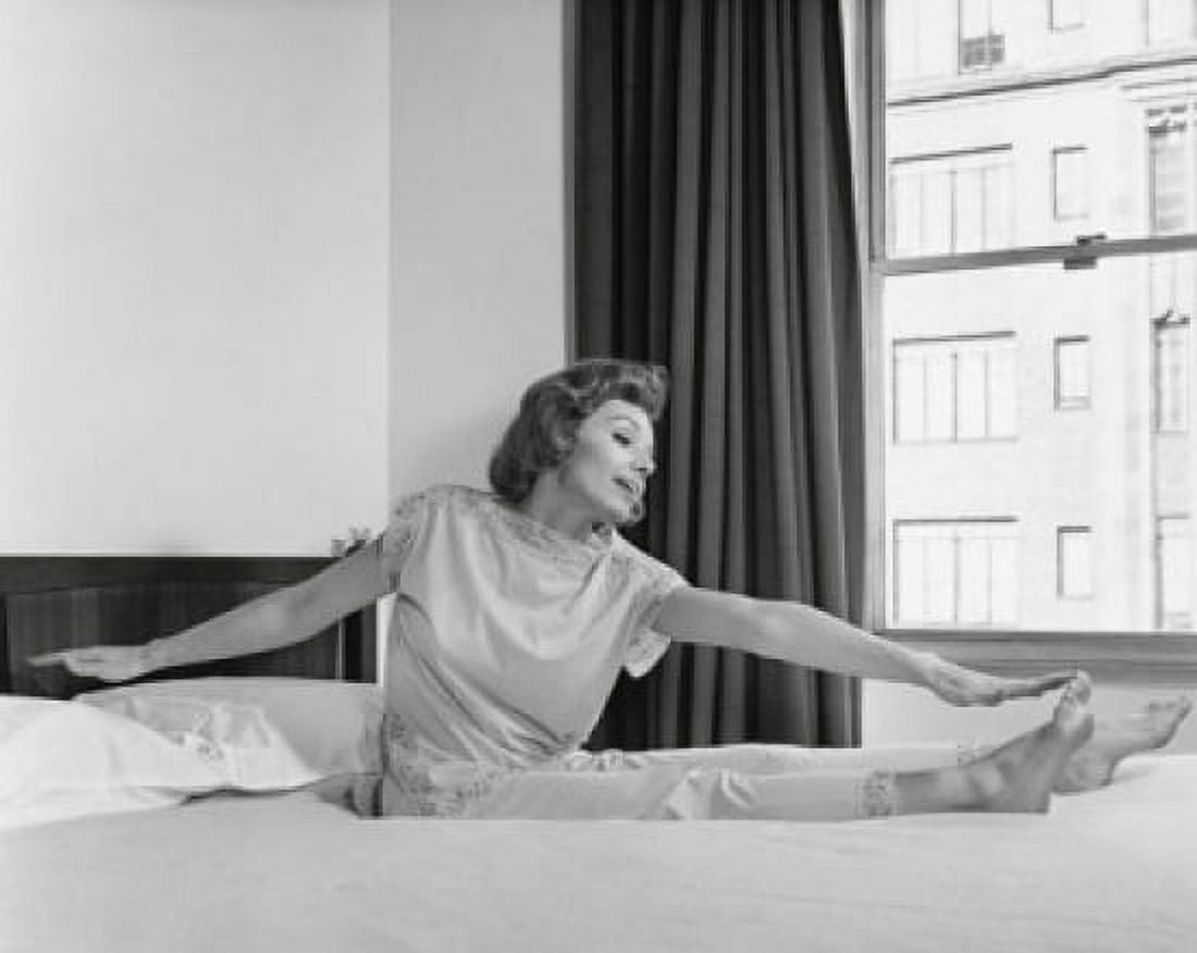 Young woman exercising on the bed Canvas Art - (18 x 24)