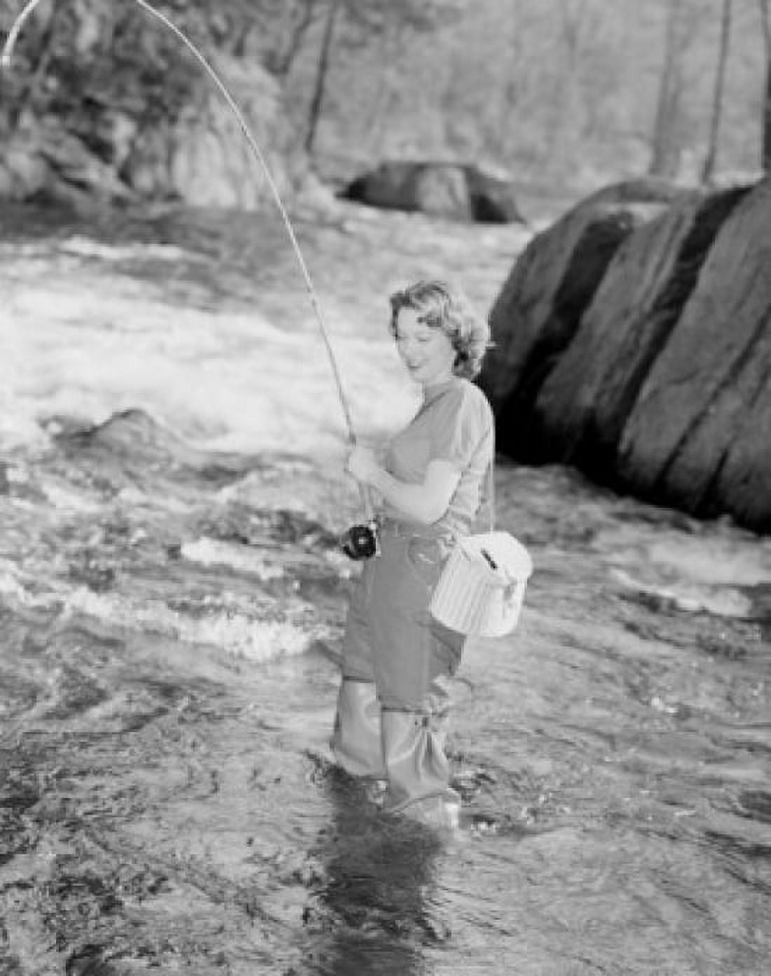 Young woman fishing in stream Canvas Art - (24 x 36)