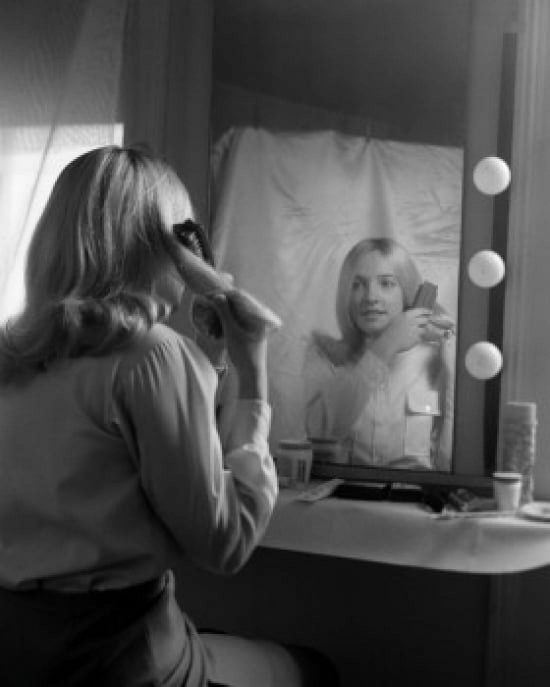 Young woman fixing hair at dressing table Canvas Art - (18 x 24)