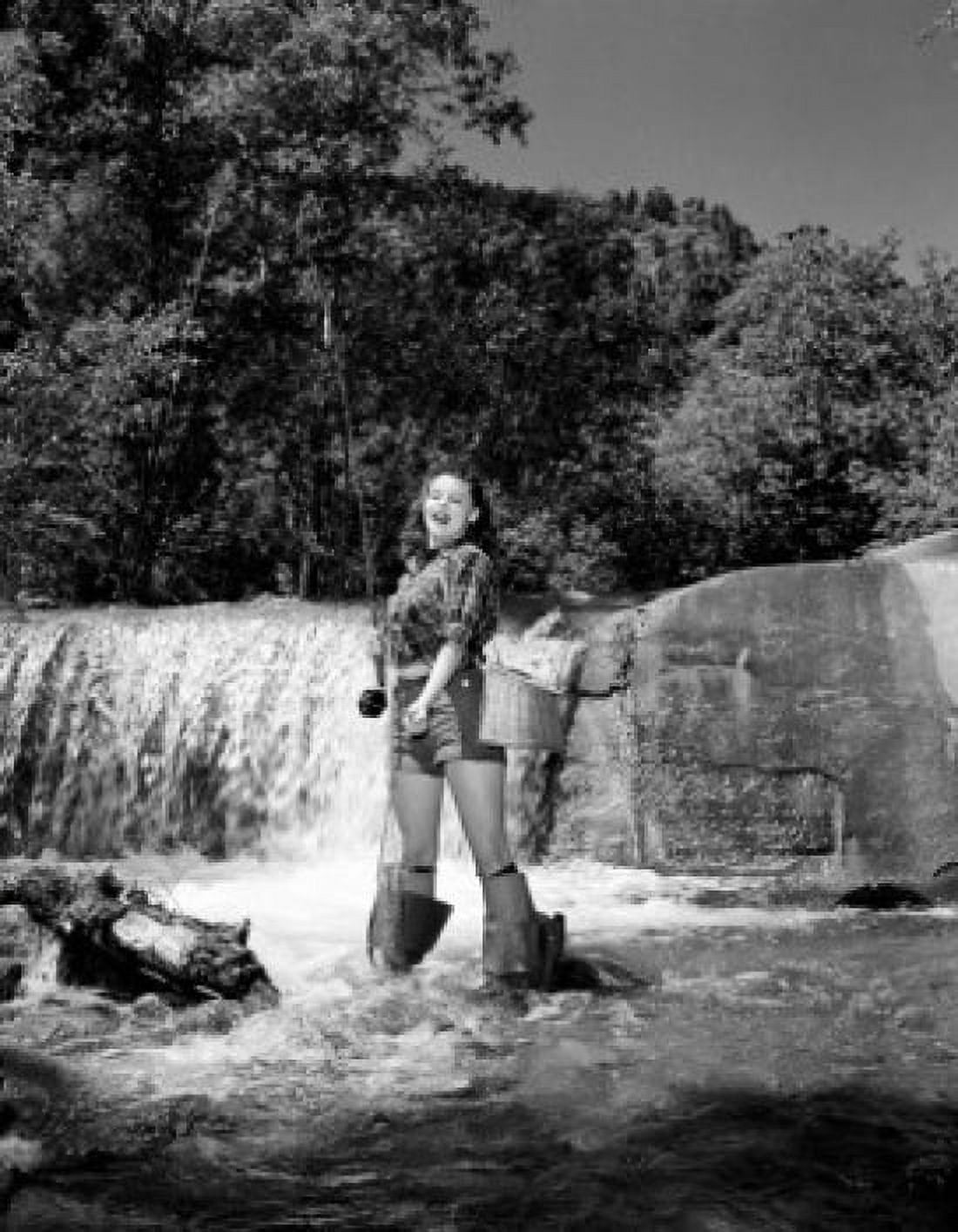 Young woman fly fishing in stream Canvas Art - (24 x 36)