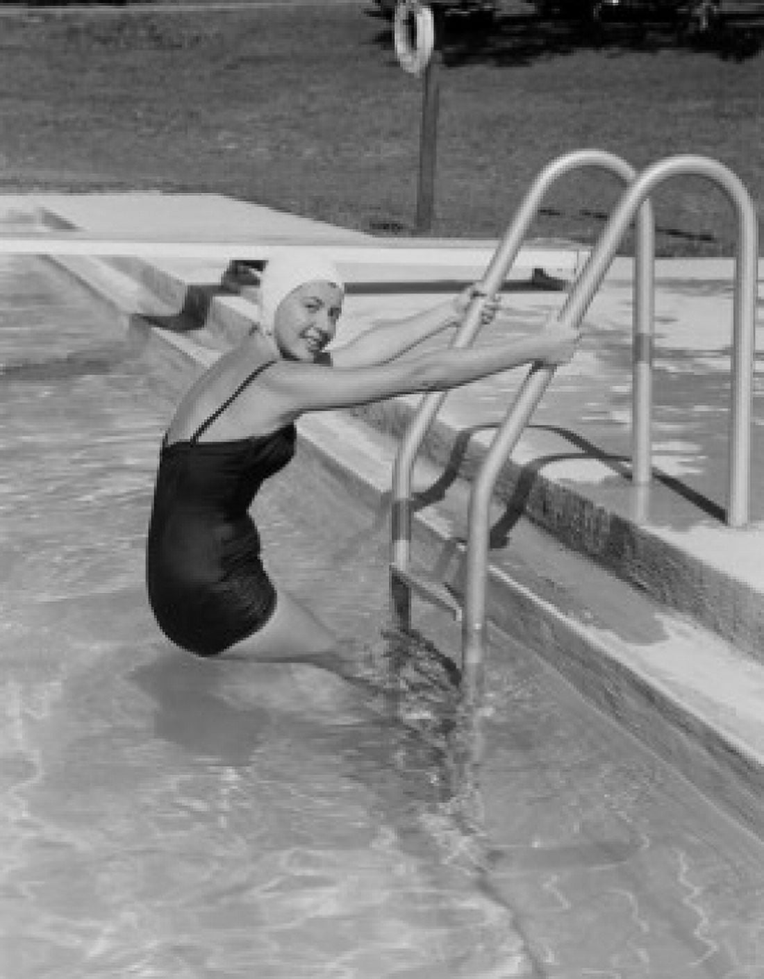 Young woman going out from swimming pool and looking at camera Canvas Art - (18 x 24)