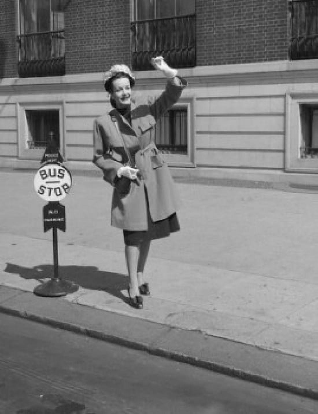 Young woman hailing bus in city Canvas Art - (18 x 24)