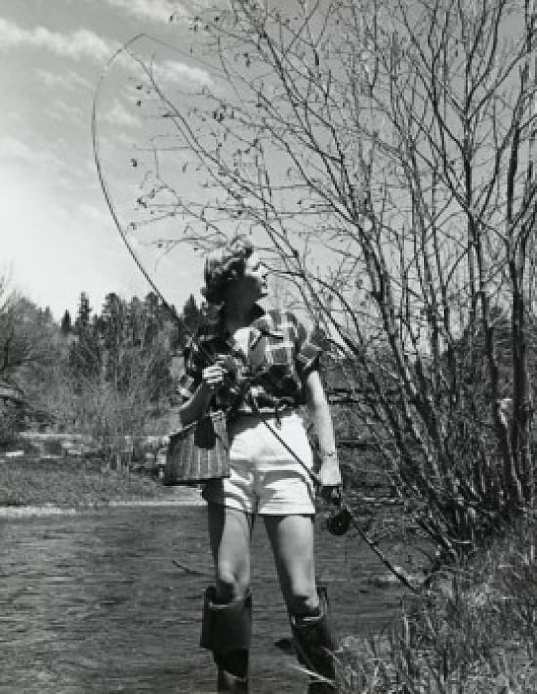 Young woman holding a fishing rod Canvas Art - (18 x 24)