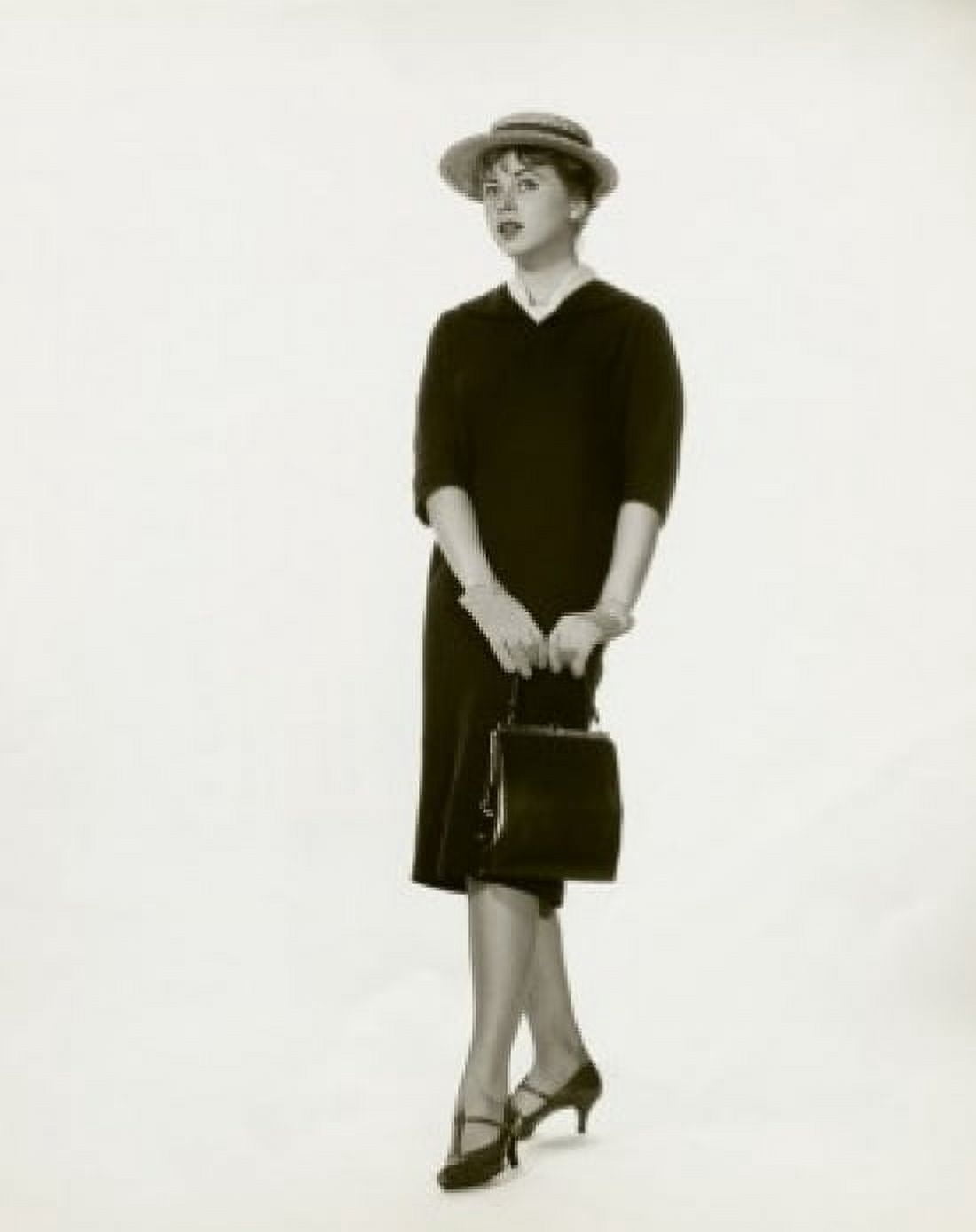 Young woman holding a hand bag Canvas Art - (18 x 24)