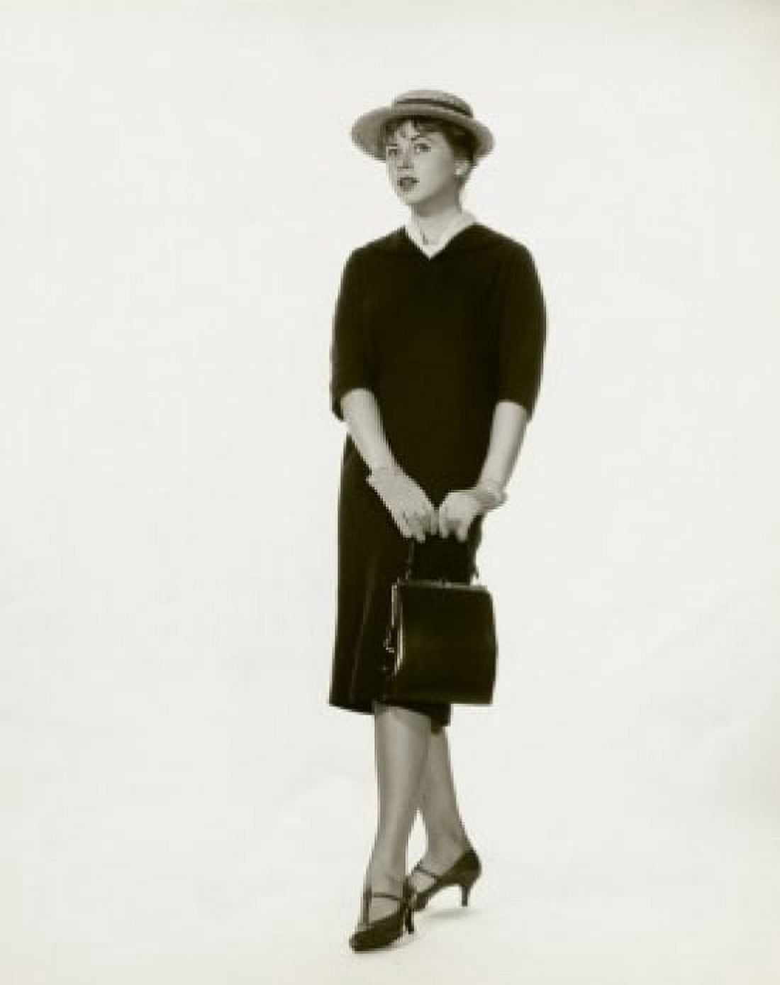 Young woman holding a hand bag Canvas Art - (24 x 36)