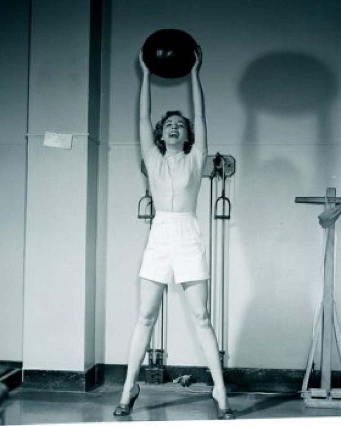 Young woman holding fitness ball in gym Canvas Art - (24 x 36)