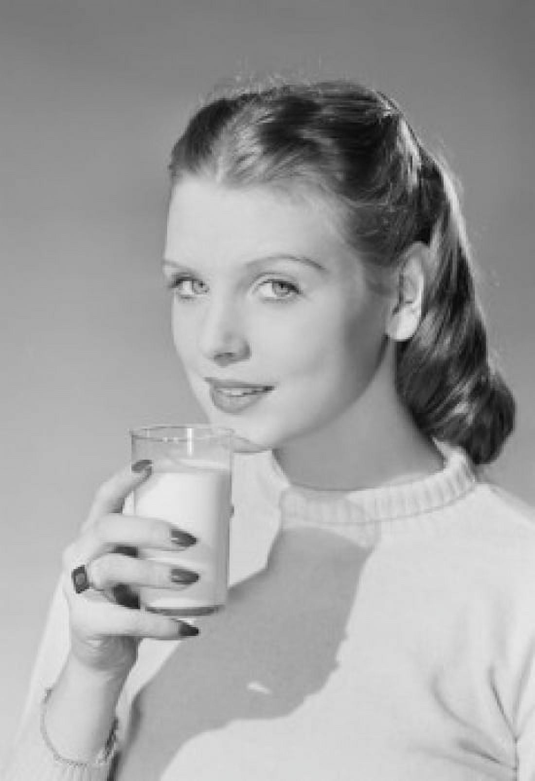 Young woman holding glass of milk Canvas Art - (18 x 24)