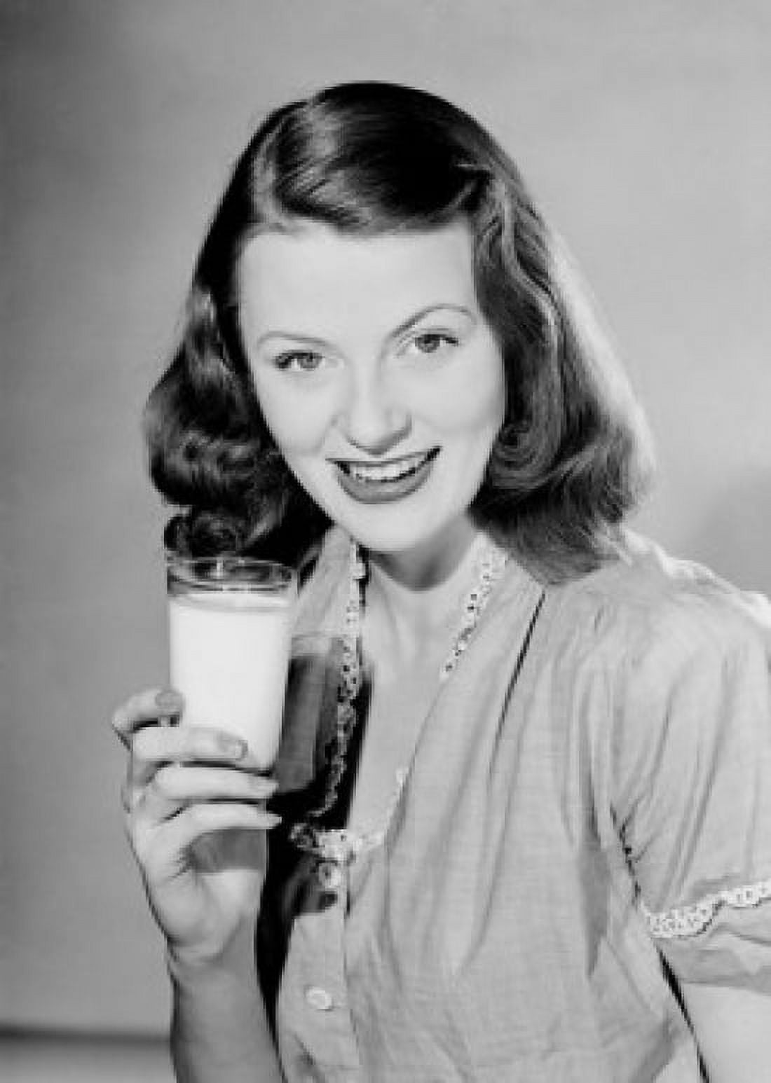 Young woman holding glass of milk Canvas Art - (18 x 24)