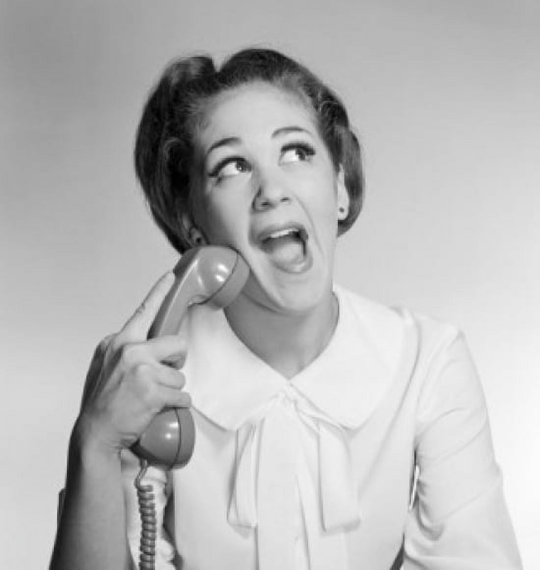 Young woman holding phone receiver and making a face Canvas Art - (18 x 24)