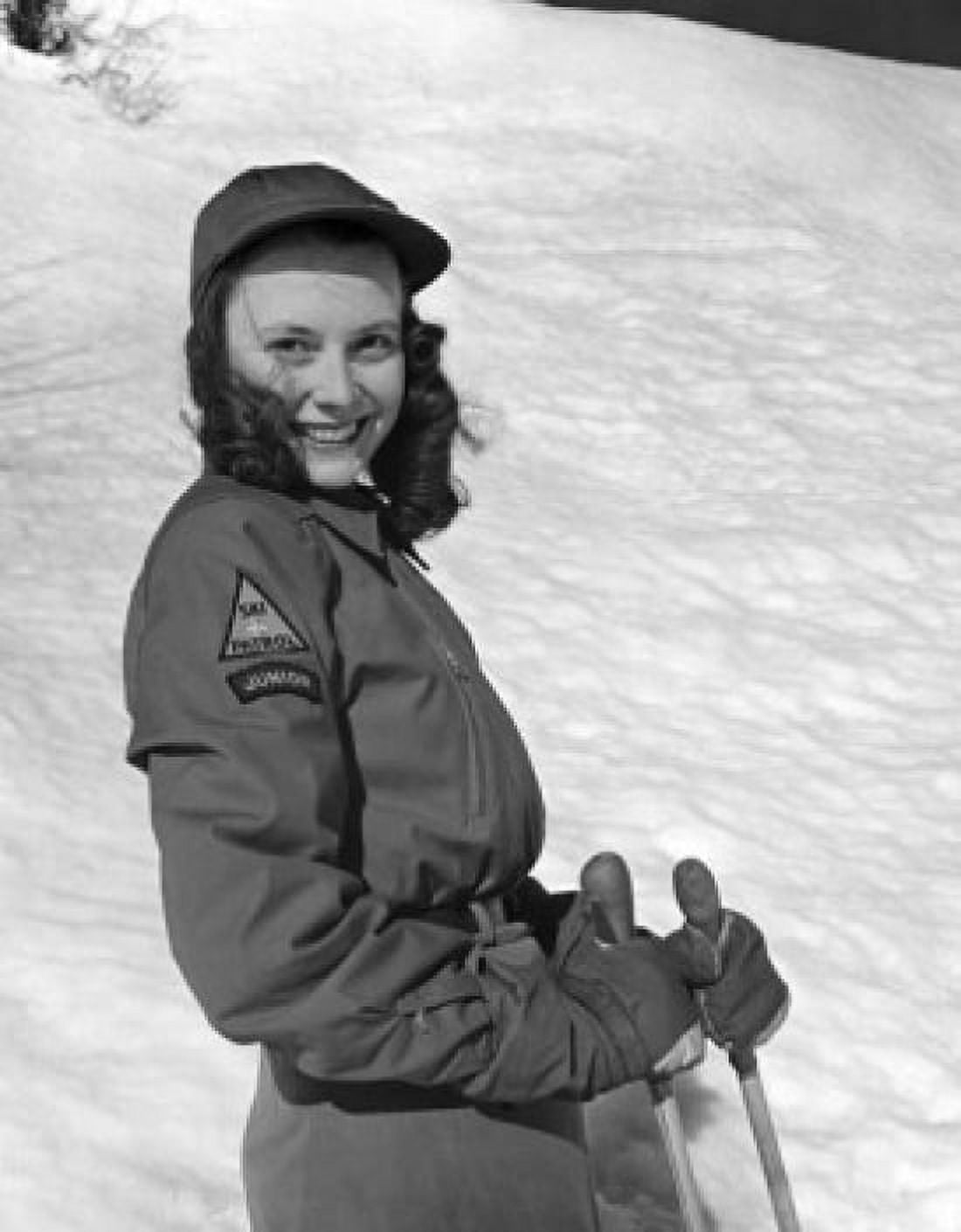 Young woman holding ski poles and smiling Canvas Art - (18 x 24)