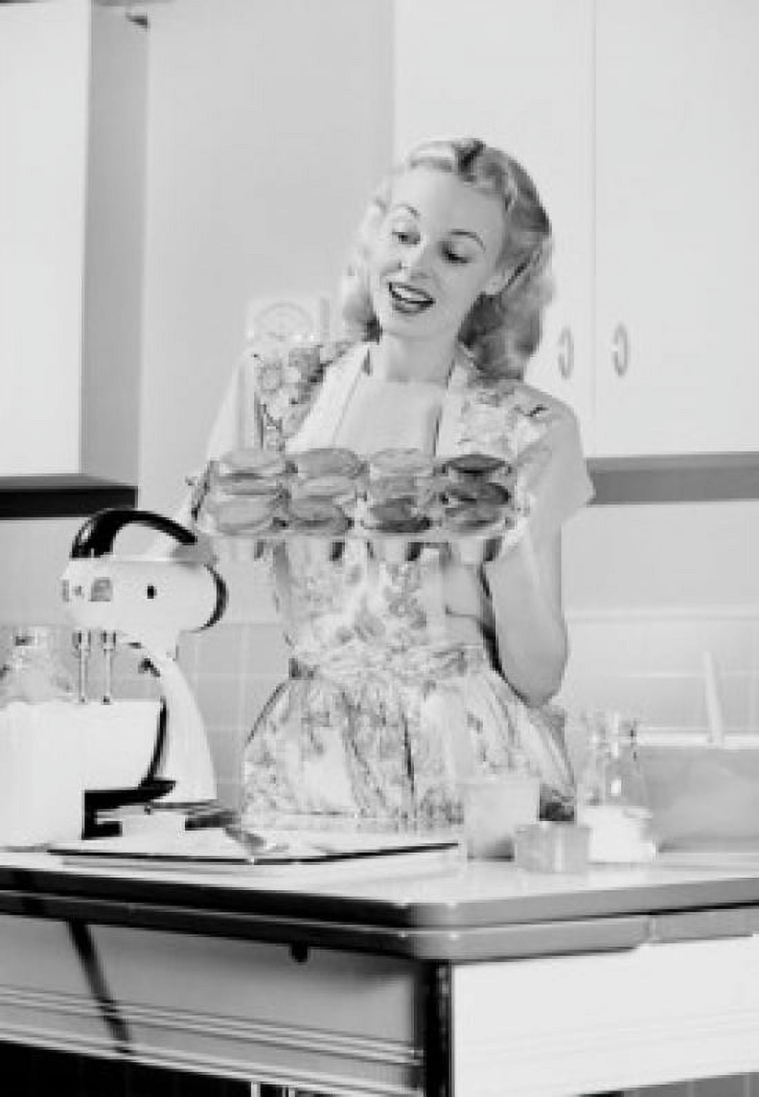 Young woman holding tray with fresh cookies Canvas Art - (24 x 36)