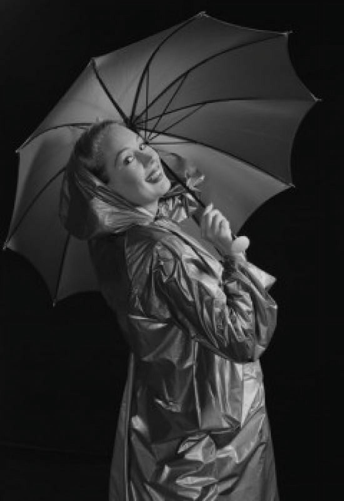 Young woman holding umbrella and wearing raincoat Canvas Art - (18 x 24)
