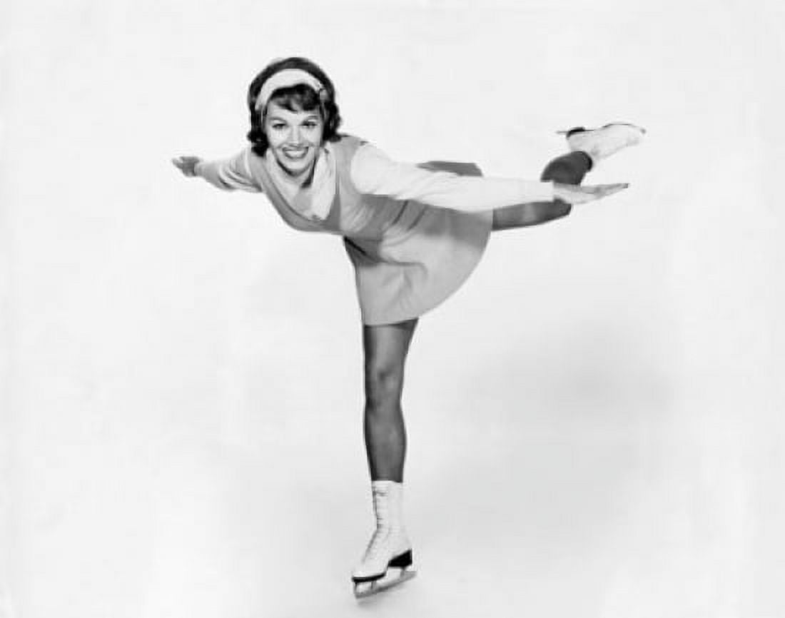 Young woman ice skating Canvas Art - (24 x 36)