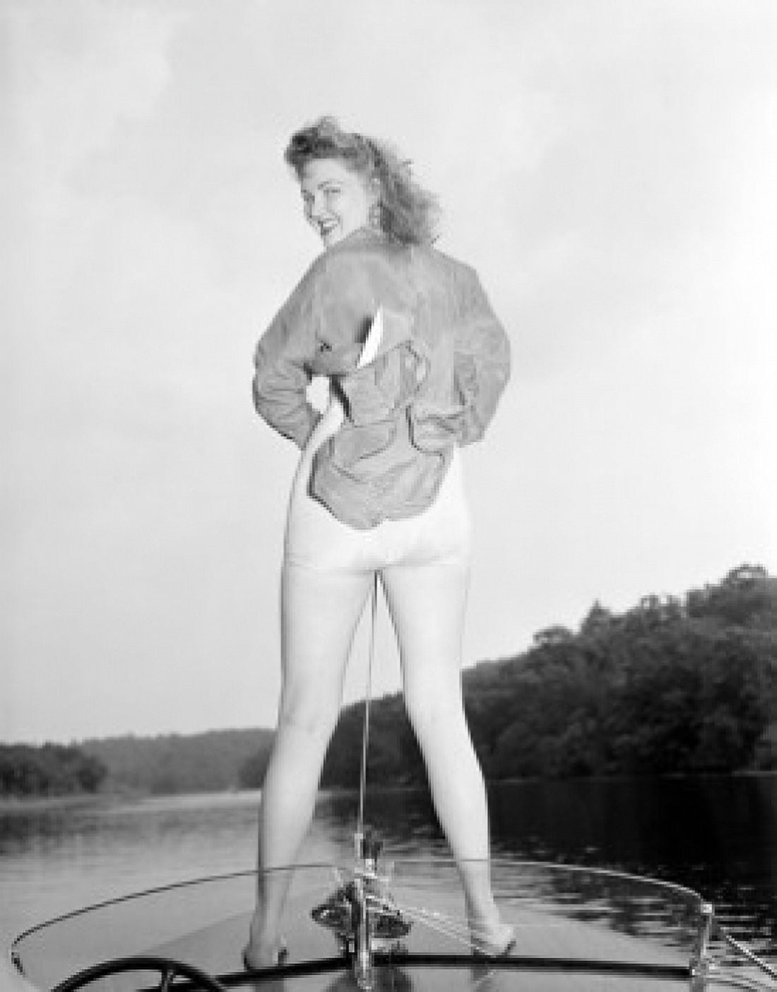 Young woman in swimsuit standing on speed boat Canvas Art - (24 x 36)