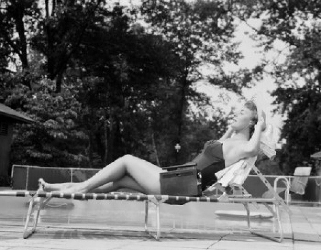 Young woman in swimsuit sunbathing Canvas Art - (18 x 24)